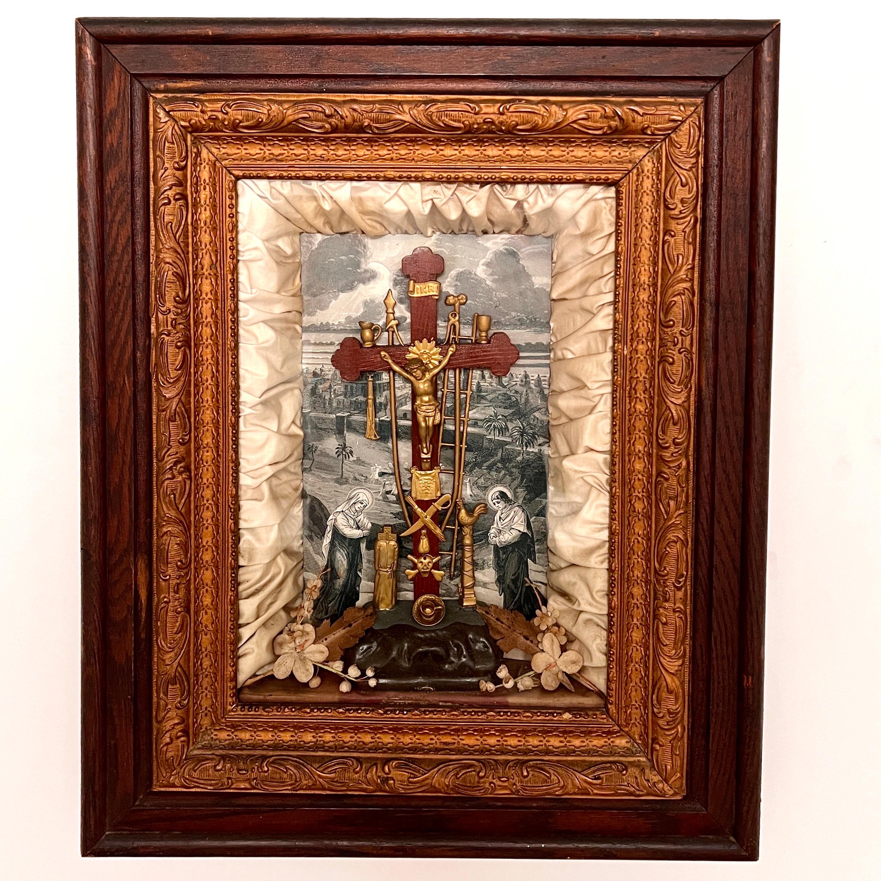 Victorian Era religious shadowbox frame depicting Christ and the instruments of Passion also known as the Arma Christi. Features background print in sepia tones with center wooden cross with a gold Christ as well as various gold metal instruments.
