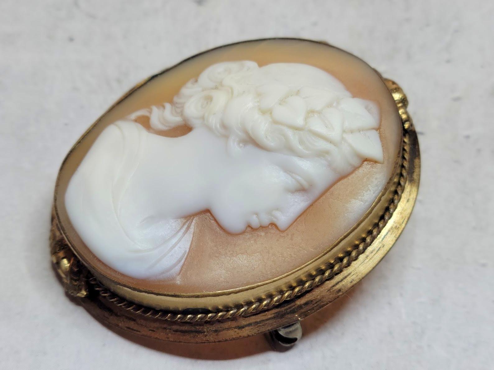 Victorian Cameo Brooch. Fabulous carved Victorian brooch made around the late 1800s. It depicts a beautiful Bacchante. The execution of the shell is amazing, and the relief helps to add details and dimension to the design. The carving is masterfully