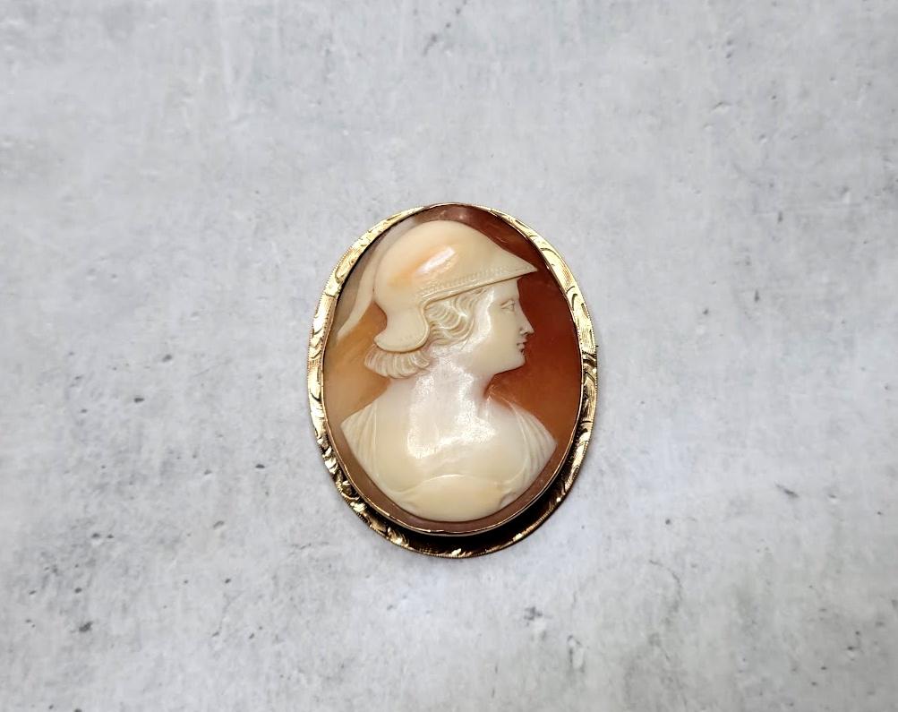 Victorian Cameo Brooch. Fabulous carved Victorian brooch made around the late 1800s. The execution of the shell is amazing, and the relief helps to add details and dimension to the design. The frame is a 10K yellow gold. The pin back hinged pin