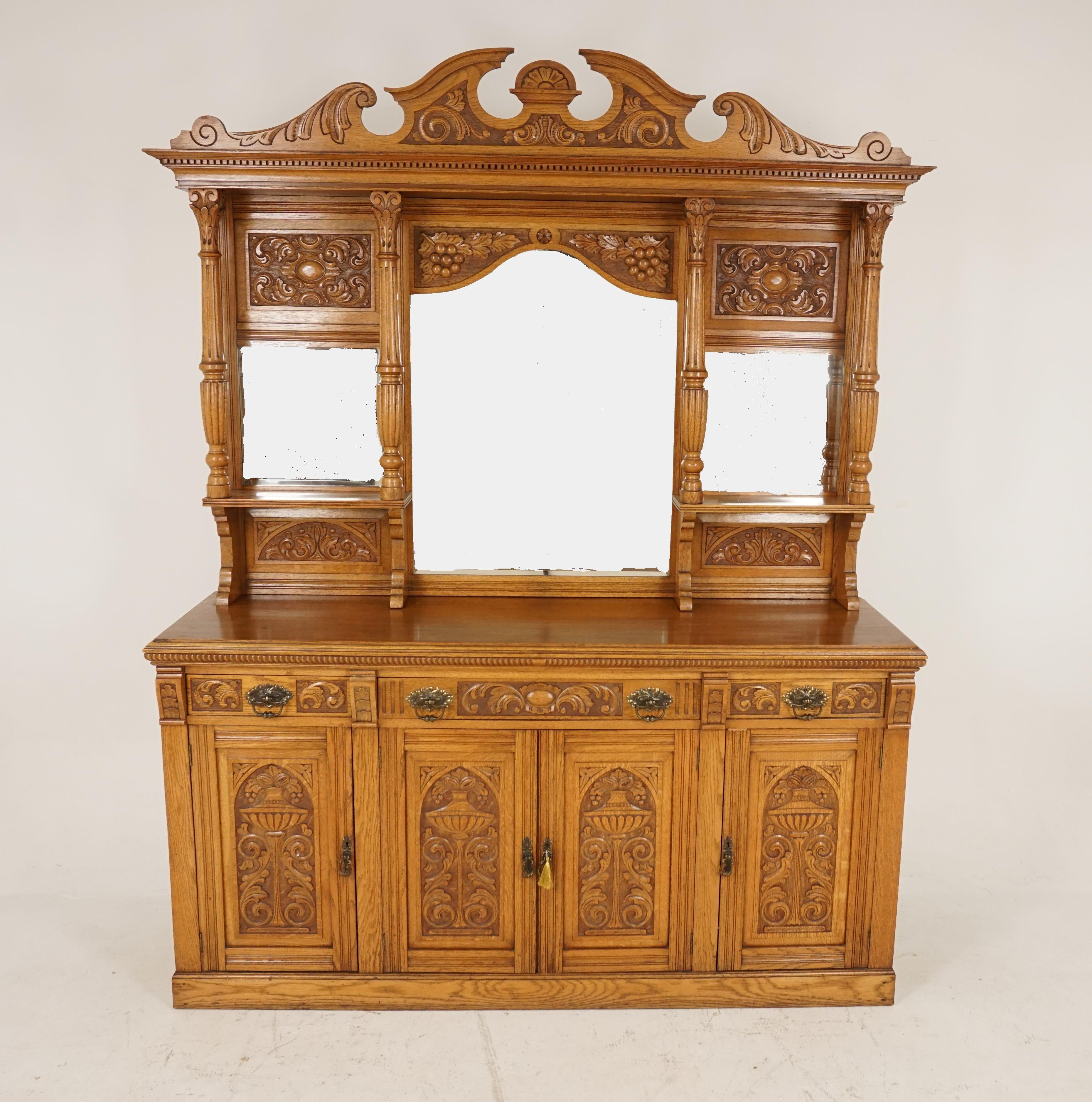 Antique Victorian sideboard, carved oak, mirror back buffet, Scotland 1890, H117

Scotland 1890
Solid oak
Original finish
Ornate carved removable pediment on top
Dented cornice below
Central shaped beveled mirror underneath
Flanked by a pair of