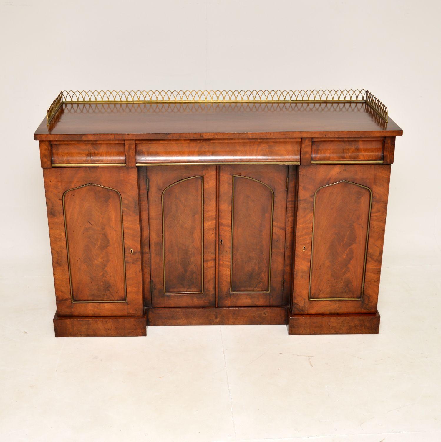 A beautiful original antique early Victorian sideboard in wood with brass adornments. This was made in England, it dates from around the 1830-1840 period.

It is very well made and is a useful size, with lots of storage space. There are three