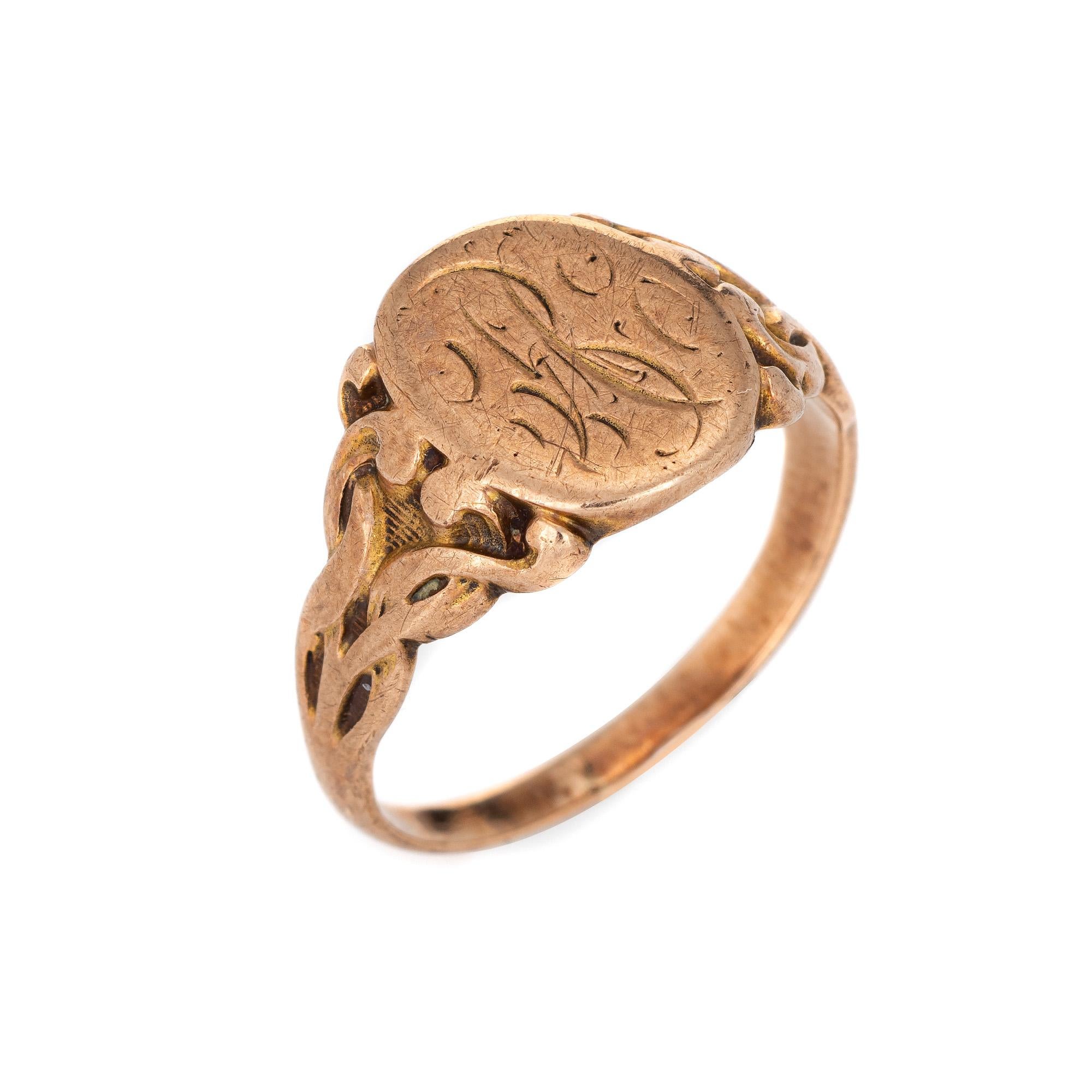 Finely detailed antique Victorian signet ring (circa 1880s to 1900s), crafted in 10 karat rose gold. 

From what we can decipher the center oval is inscribed with the initials 