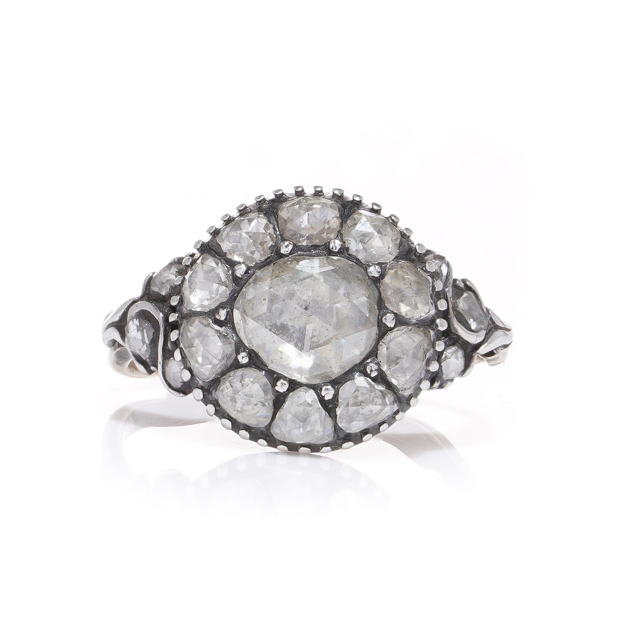 Antique Victorian silver and 9kt gold rose - cut diamond cluster ring. 

Item Specifics: 
Dimensions - 
Ring size: 2.5 x 2 x 1.6 cm 
Finger Size: (UK) J (EU) = 50 S) = 5 
Weight: 4.00 grams


Diamonds -
Cut: Rose - cut
Quantity of stones: 17 
Total
