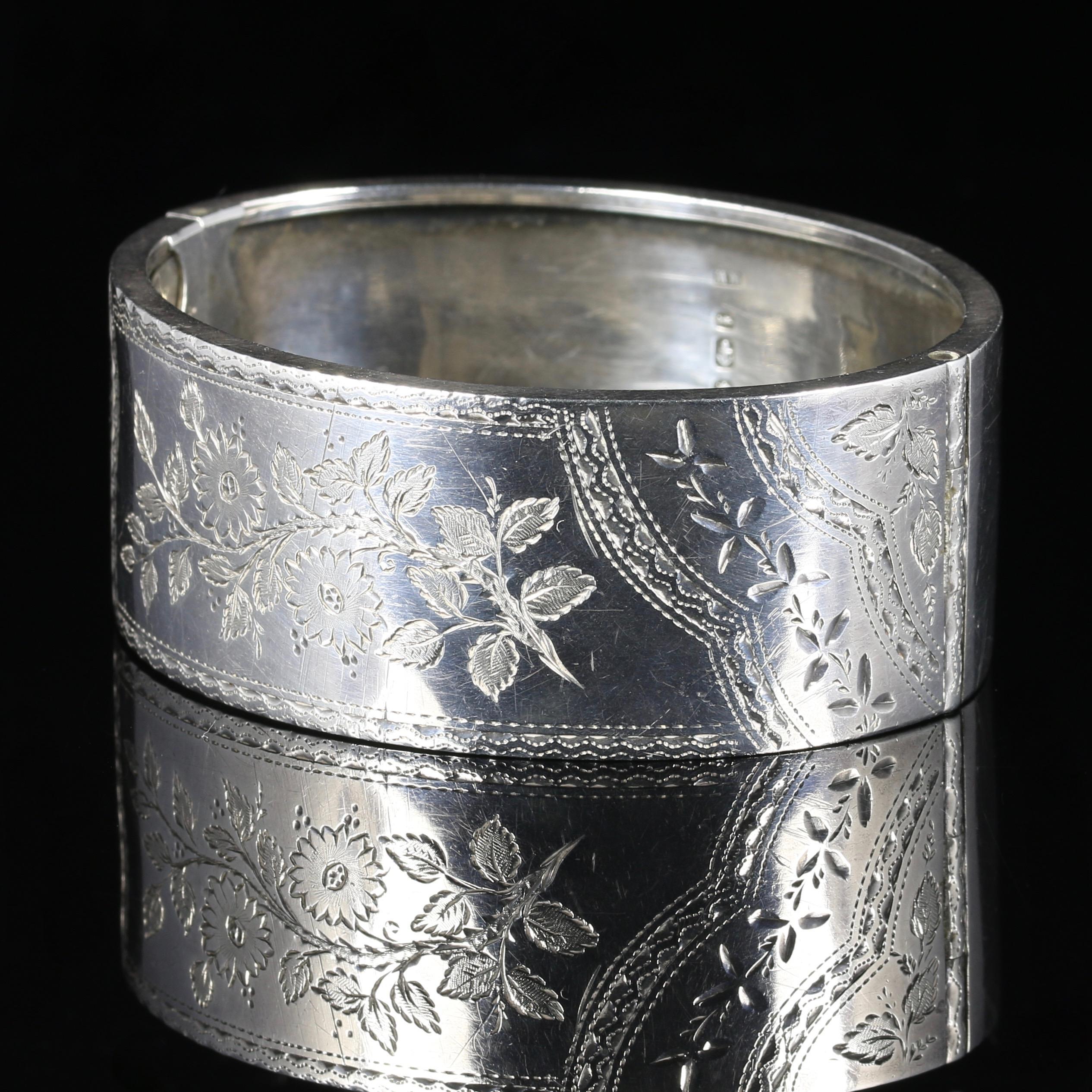 For more details please click continue reading down below...

This fabulous antique Victorian Sterling Silver bangle is dated Birmingham 1893.

Steeped in English history and adorned with pristine workmanship.

Ivy means I cling to thee. Forget me