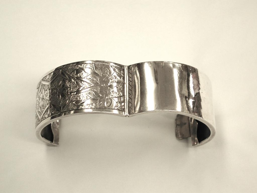Antique Victorian silver bangle, William Walker, Birmingham, 1881
Beautifully hand engraved with flower and leaf-work.
 