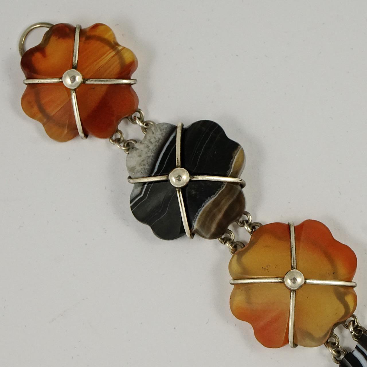 Victorian silver bracelet with beautiful agate flowers, and a simple hook fastening. The lovely carved and polished agate links include banded agate and carnelian. The bracelet tests as silver. Measuring length 18.5cm / 7.3 inches by width 2.5cm / 1