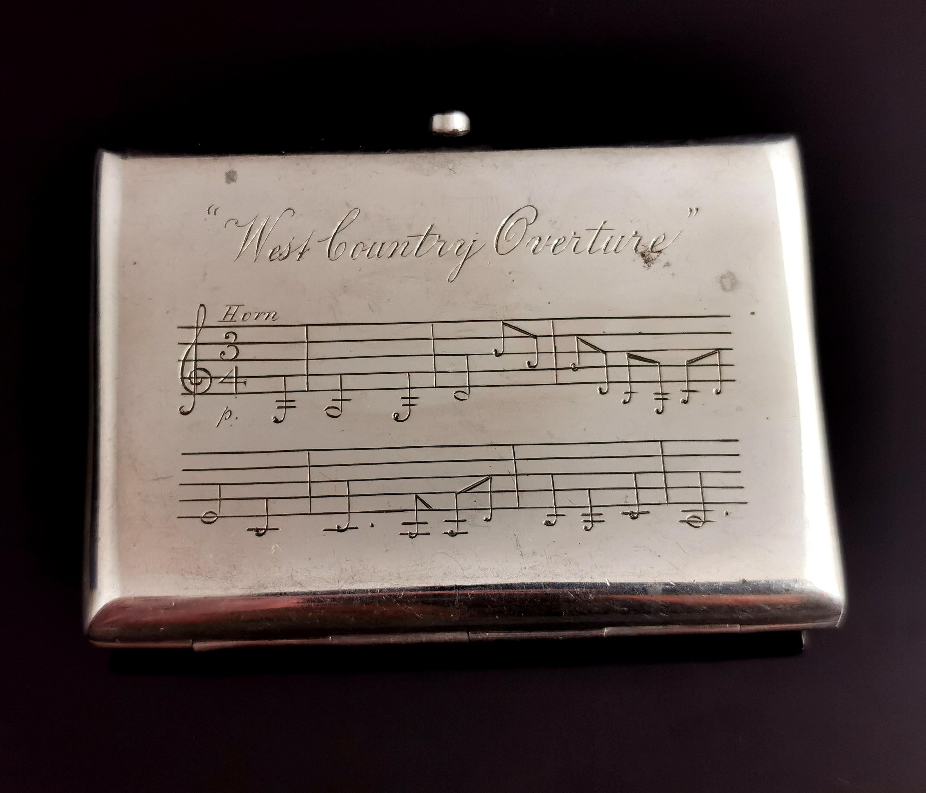 An unusual antique cigarette case, Victorian era sterling silver, it is engraved with musical staves from the West Country Overture.

A fully hallmarked smooth silver case, engraved to the front and the back.

Gilt lined with the original interior