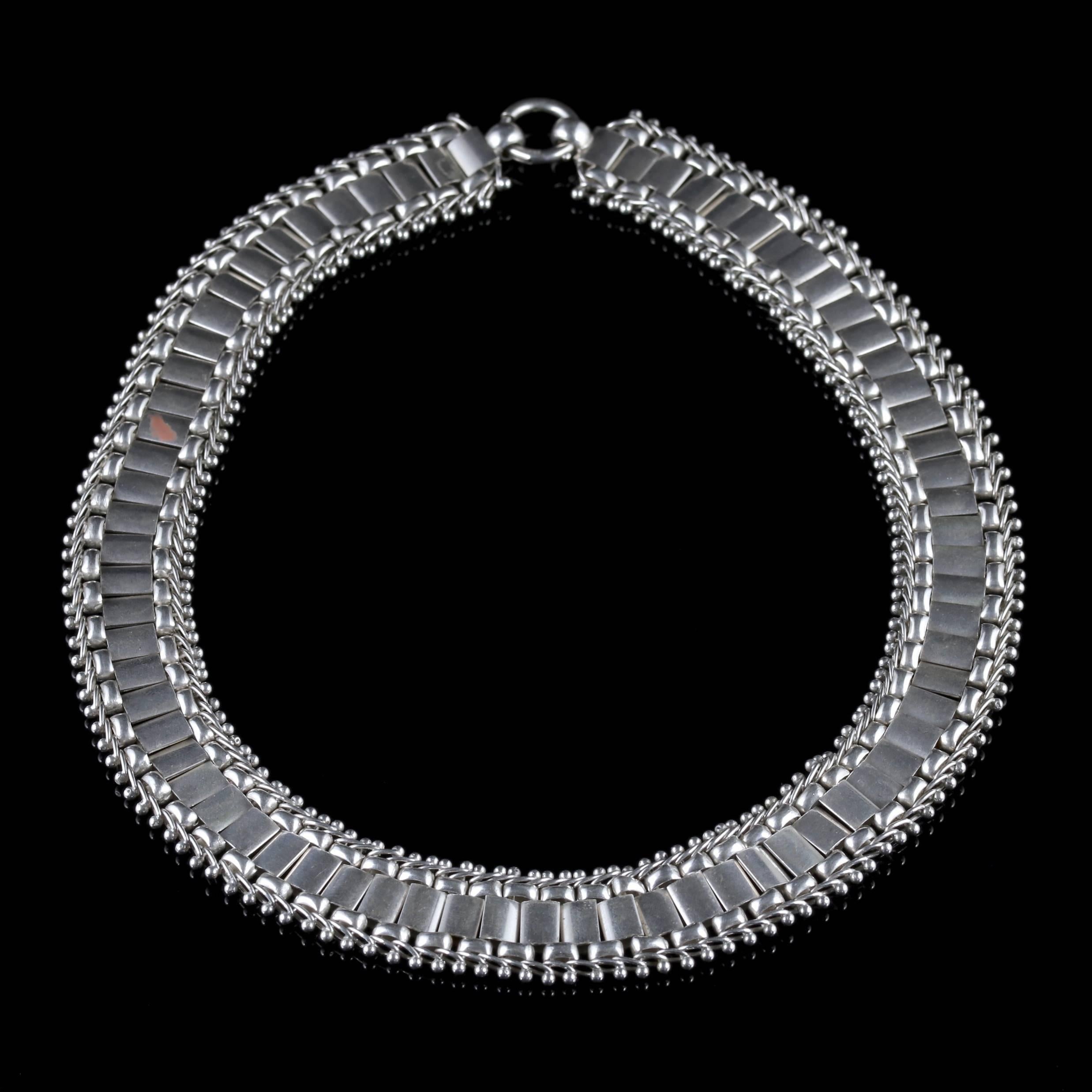 To read more please click continue reading below-

This stunning antique Sterling Silver collar necklace is Victorian Circa 1880.

The collar is articulated and durable boasting detailed engravings on each panel.

All set in Sterling Silver and
