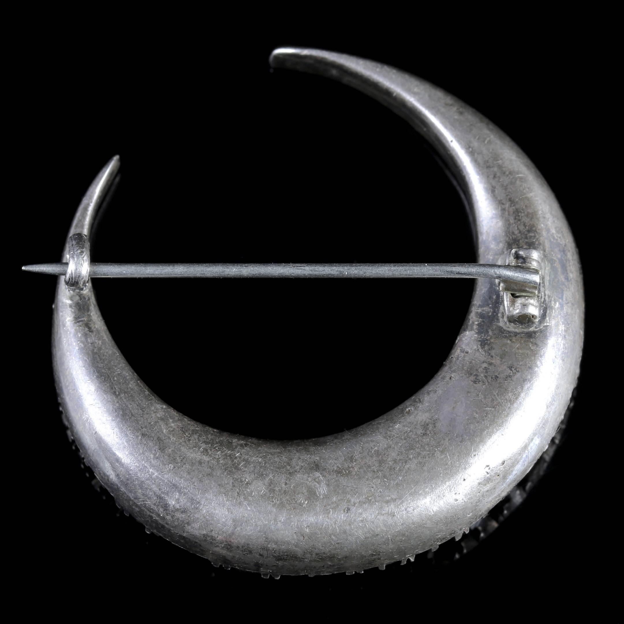 To read more please click continue reading below-

This fabulous antique Silver Crescent moon Paste Brooch is genuine Victorian Circa 1860. 

The wonderful brooch depicts a crescent moon adorned with sparkling white Paste Stones graduating in