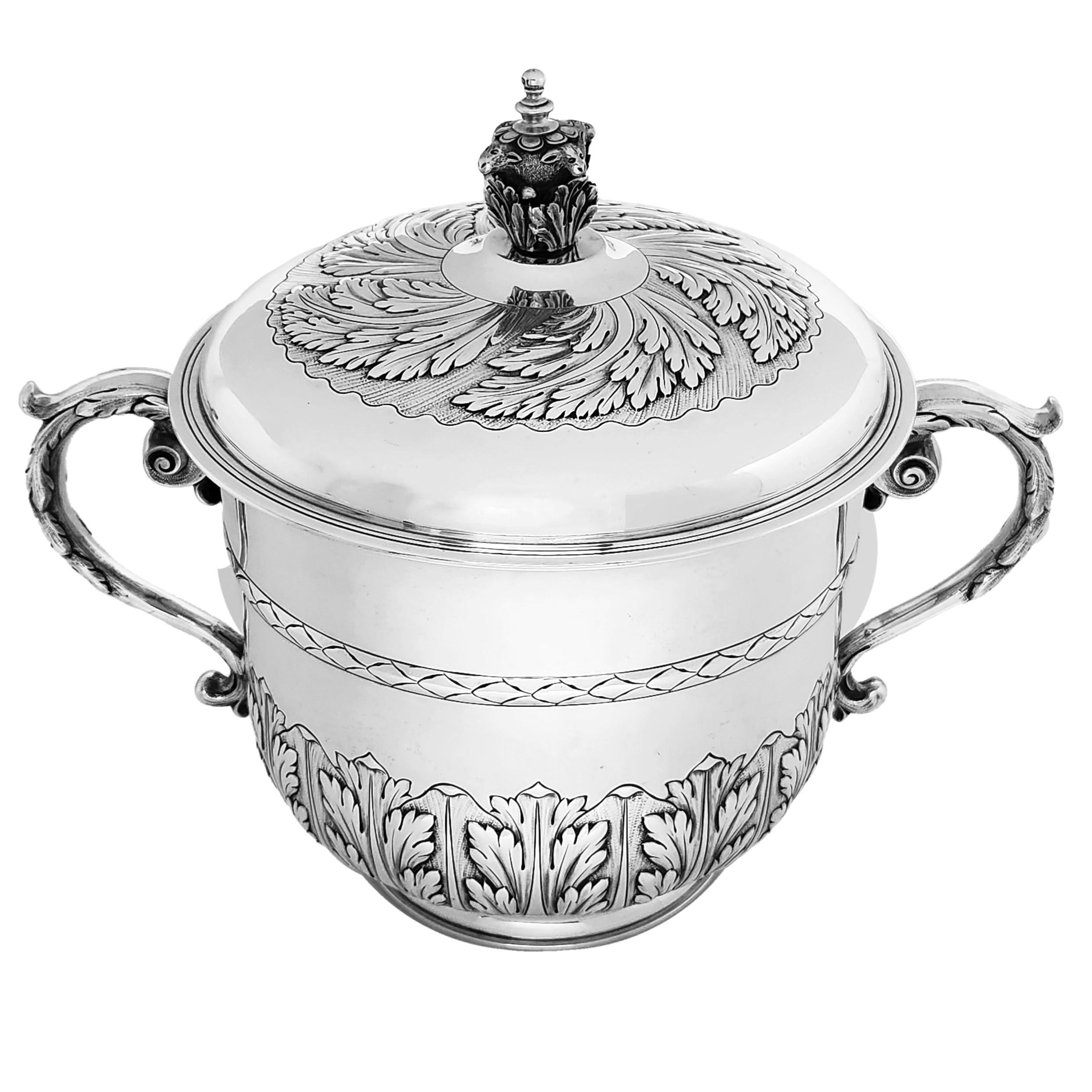 A magnificent Sterling Silver Lidded Cup in the style of a 17th Century Charles II Porringer. The Body and Lid of the Porringer are embellished with beautiful chased patterns featuring stylised foliate designs. The Lid of the Porringer has an