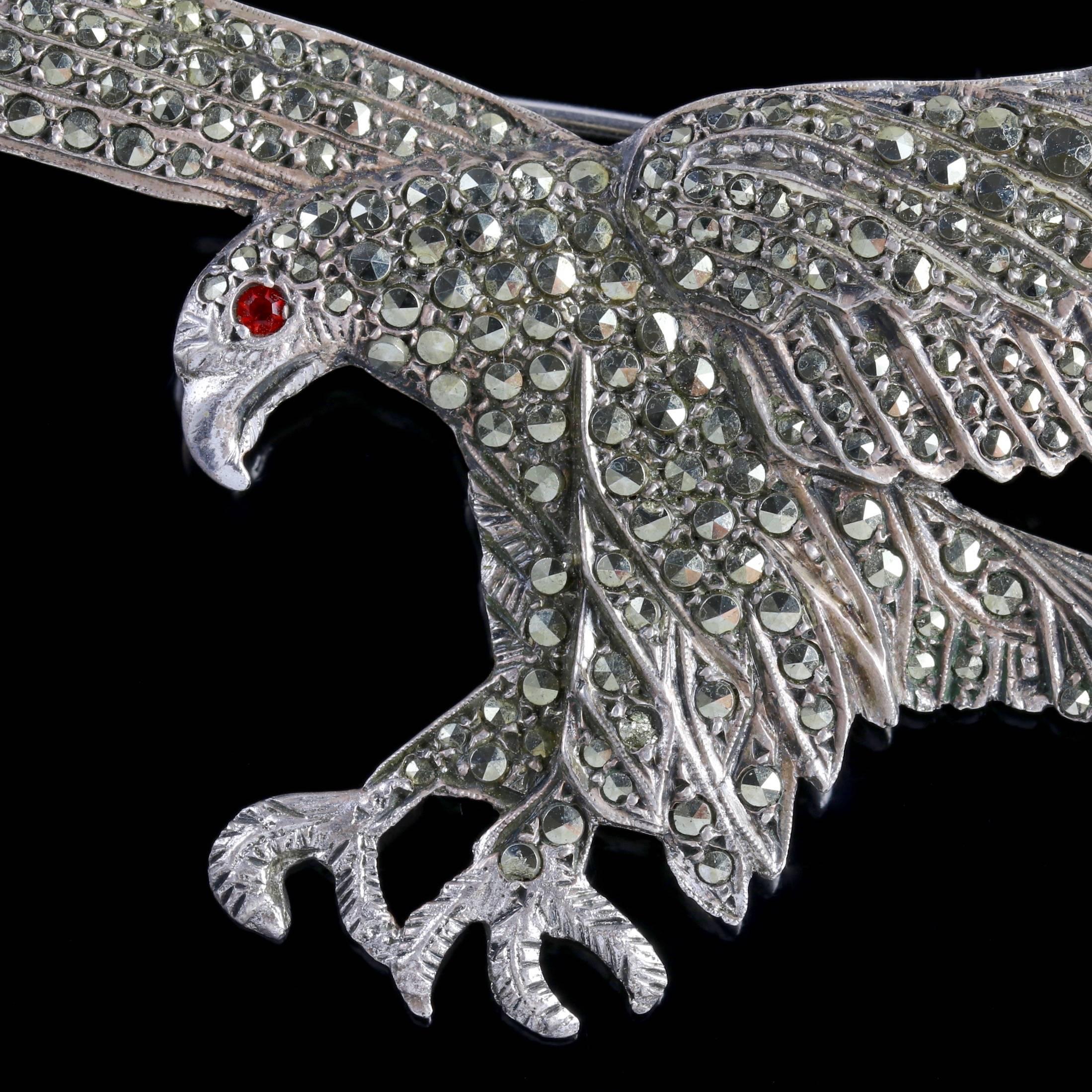 To read more please click continue reading below-

This stunning large antique Silver Victorian Eagle brooch is Circa 1900. 

The detailed Eagle is depicted wings outstretched and decorated in sparkling Cut Steel studs with a red Paste eye. 

Cut