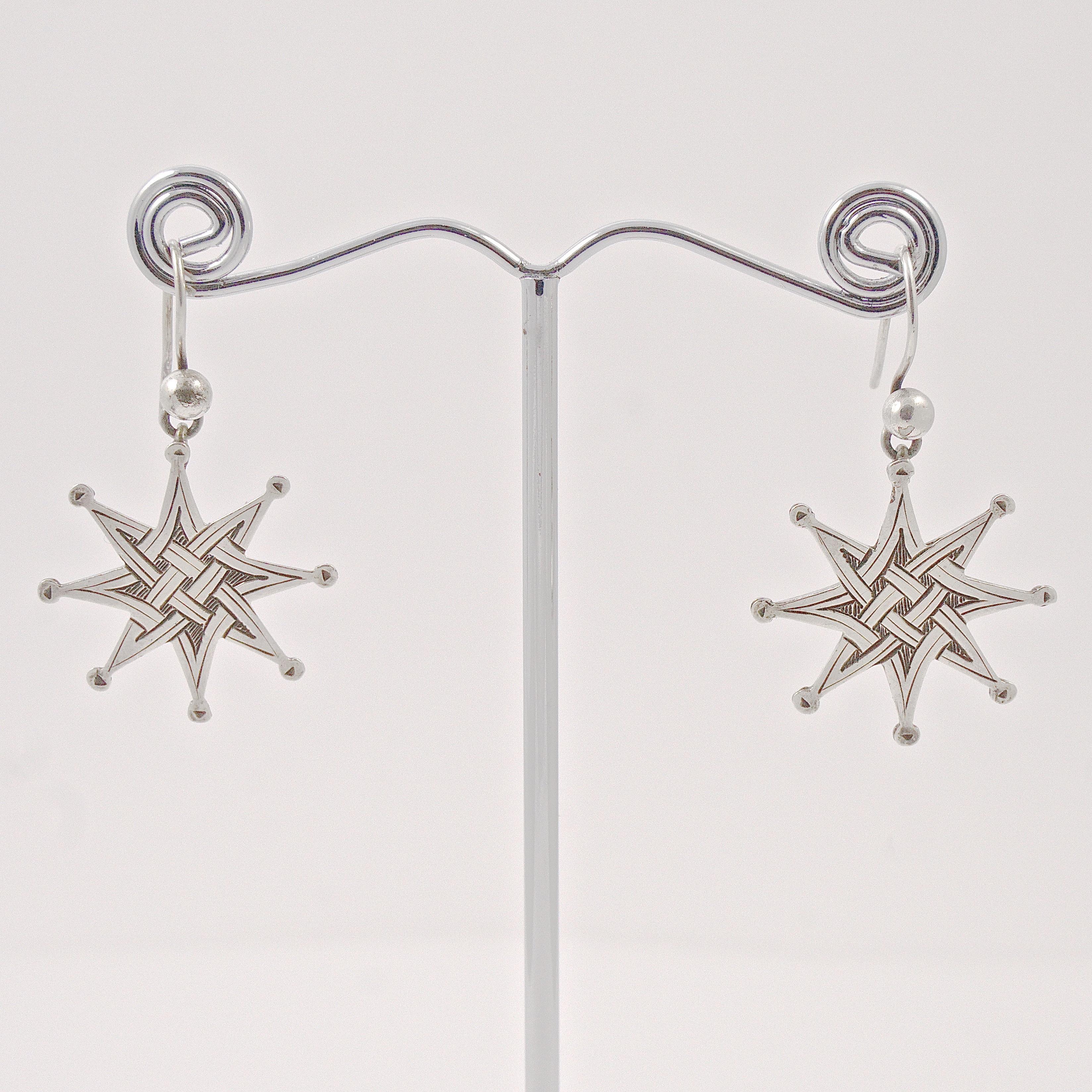 Beautiful antique silver star drop earrings, featuring a lovely hand engraved Celtic design. Measuring diameter 2.25cm / .88 inch, they are unmarked but test for silver. The earrings are in very good condition, with scratching as expected, and some