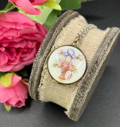 Medallón victoriano antiguo de plata con esmalte floral