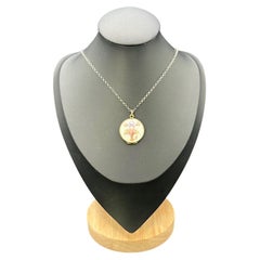 Medallón victoriano antiguo de plata con esmalte floral