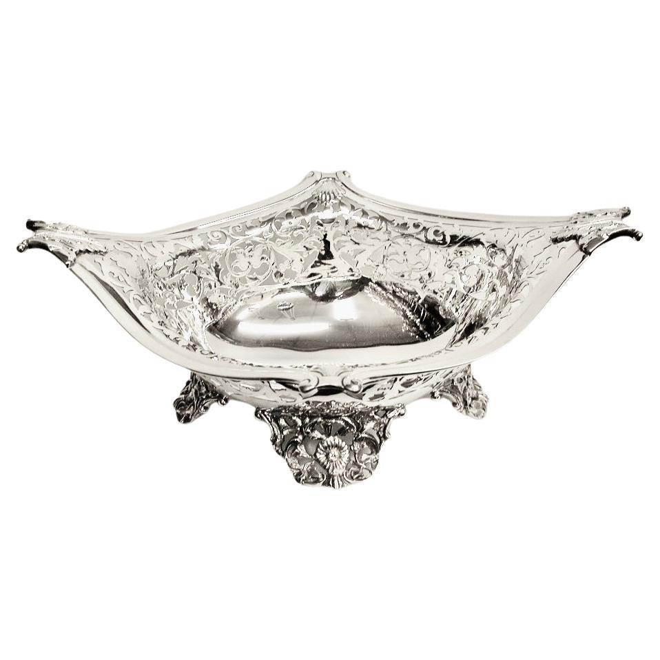 Antique Victorian Silver Fruit Basket Dated 1898 London William Hutton & Sons Ltd
Fabulous Basket which can be used for so many things other than fruit, i.e bread, sweets, chocolates
petit-fours etc.The 4 feet are beautifully cast and the delicate