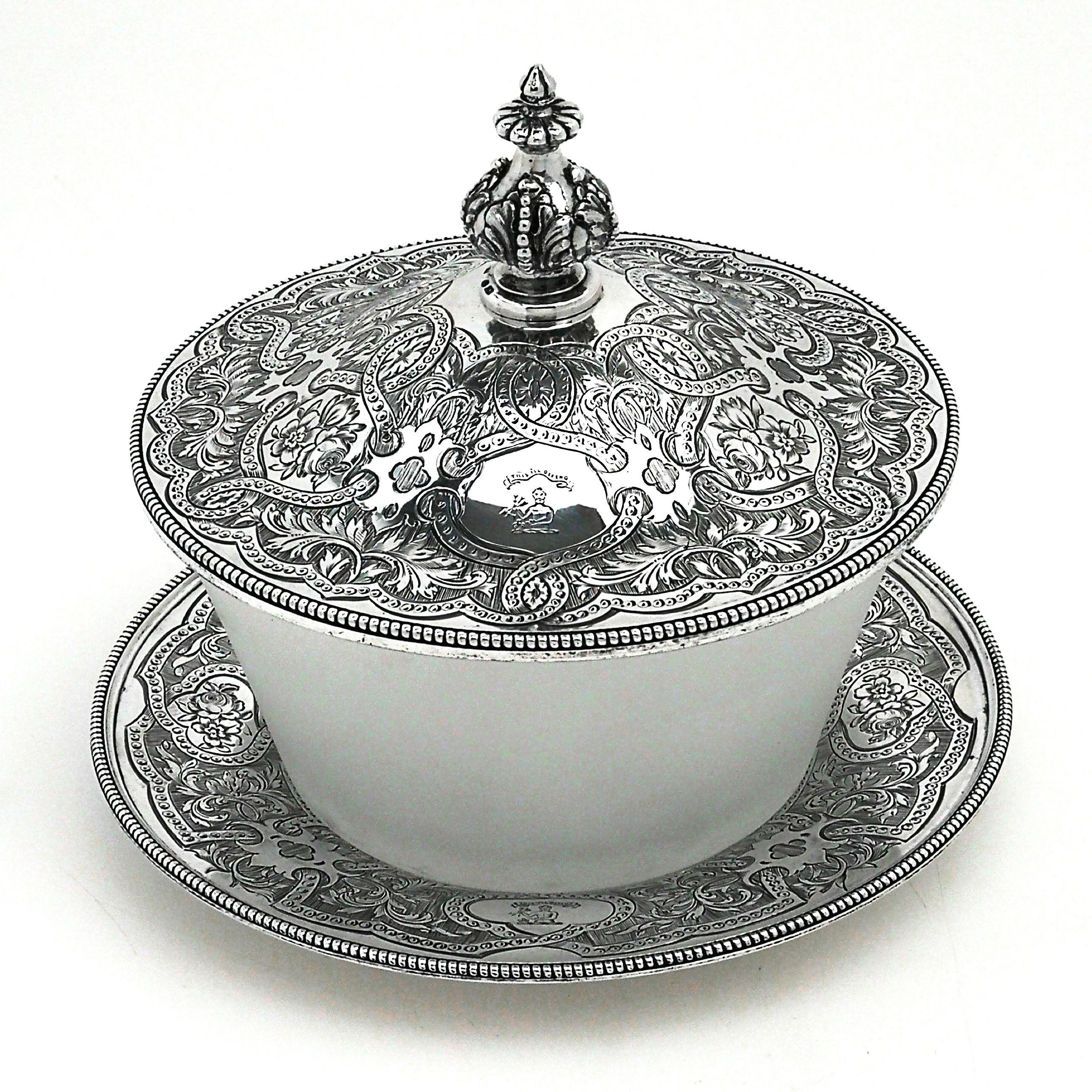 A gorgeous antique Victorian solid silver & glass butter dish. This butter dish has a frosted glass body standing on solid silver under plate and with a domed silver lid. Both the plate and the lid are embellished with gorgeous ornate engraving