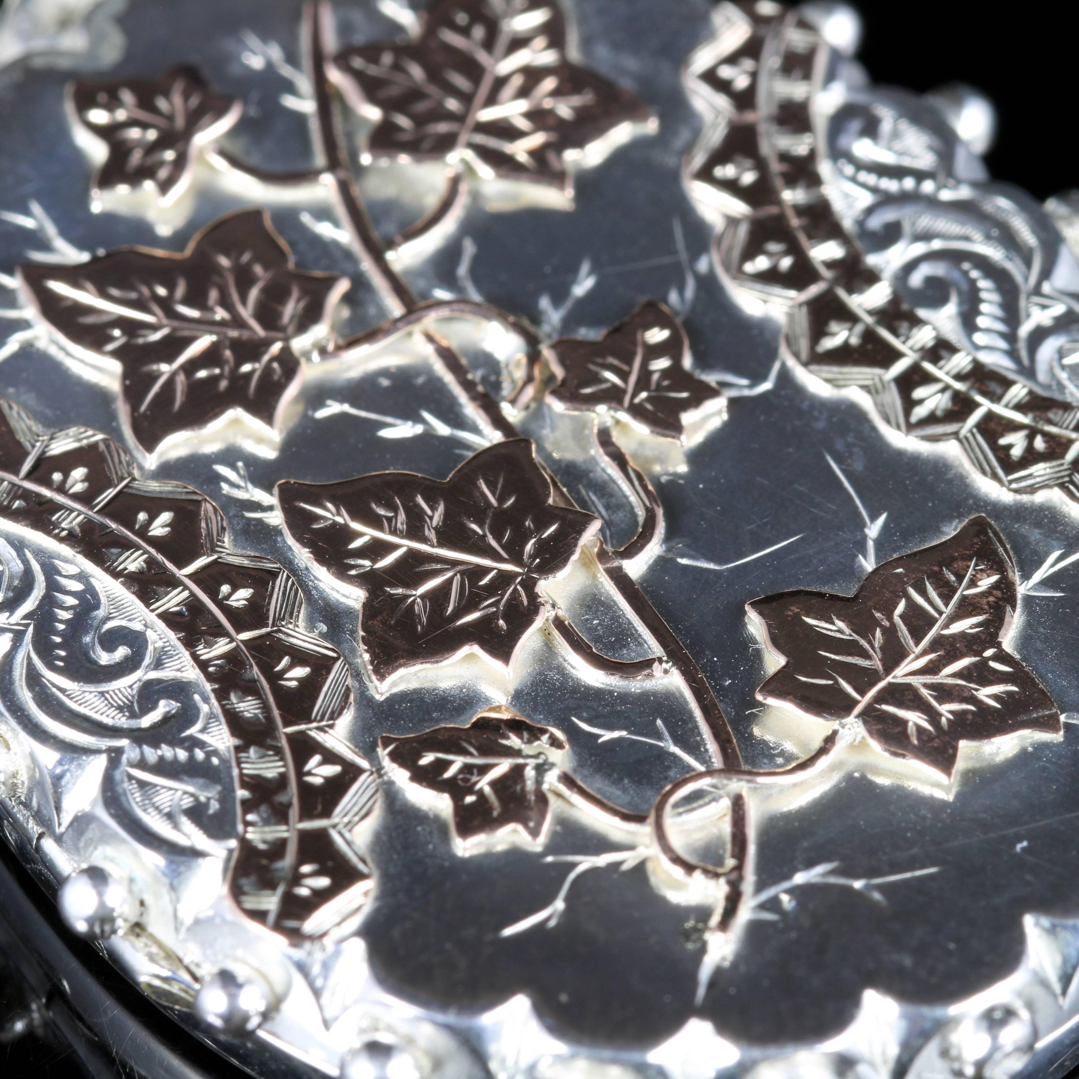 For more details please click continue reading down below...

This beautiful antique Victorian Sterling Silver locket is set with fabulous Gold ivy detail.

Ivy means cling to thee and forget me nots is a symbol of never be forgotten.

Inside the