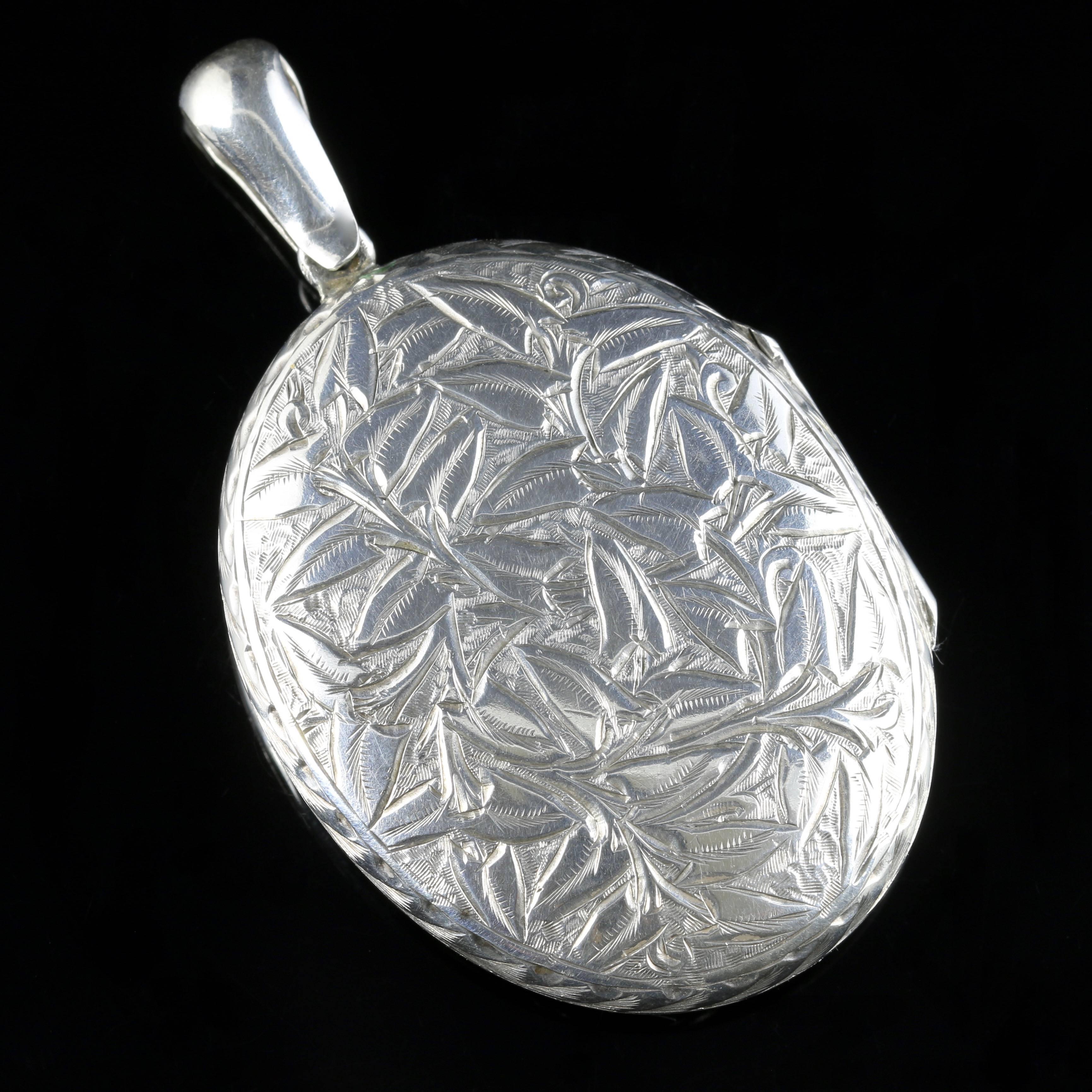 For more details please click continue reading down below...

This beautiful antique Victorian Sterling Silver engraved Ivy locket is Circa 1900.

The wonderful locket is beautifully engraved with detailed Ivy which represents a loving eternal