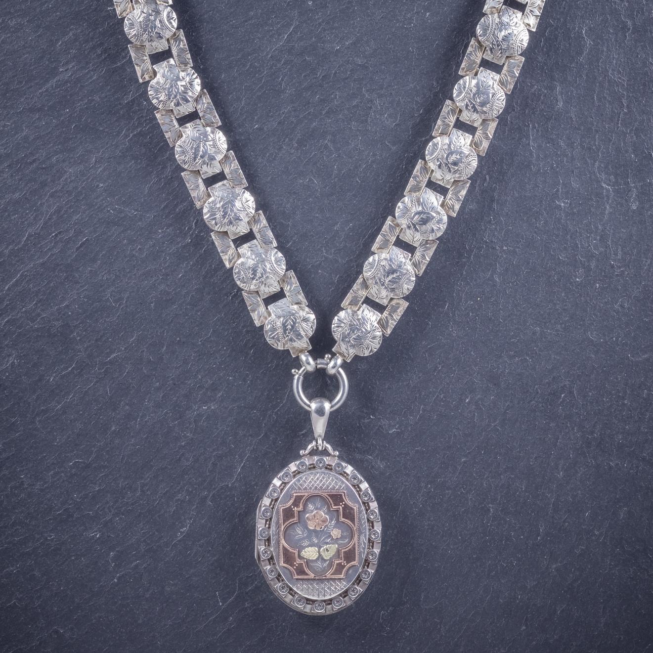 A grand antique Victorian collar Circa 1860, featuring a lovely locket engraved with an 18ct Gold Forget me not on the front inside a Rose Gold frame. 

The locket is bordered in stars and features a large ‘B’ initial on the back which may have been