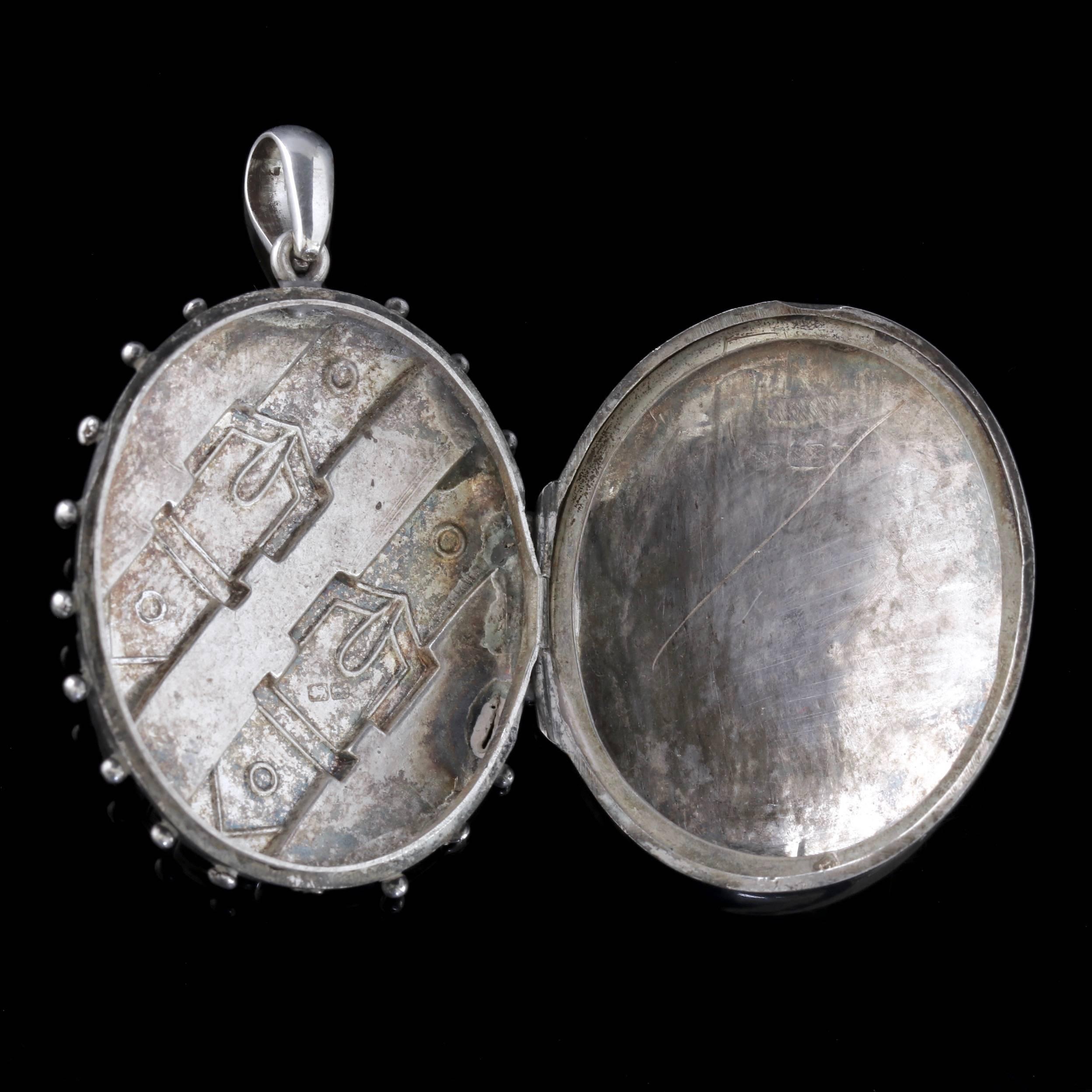 To read more please click continue reading below-

This beautiful antique Victorian Sterling Silver buckle Locket is dated 1883. 

The wonderful Locket displays a beautiful natural leaf patterning with two engraved buckles wrapped around the