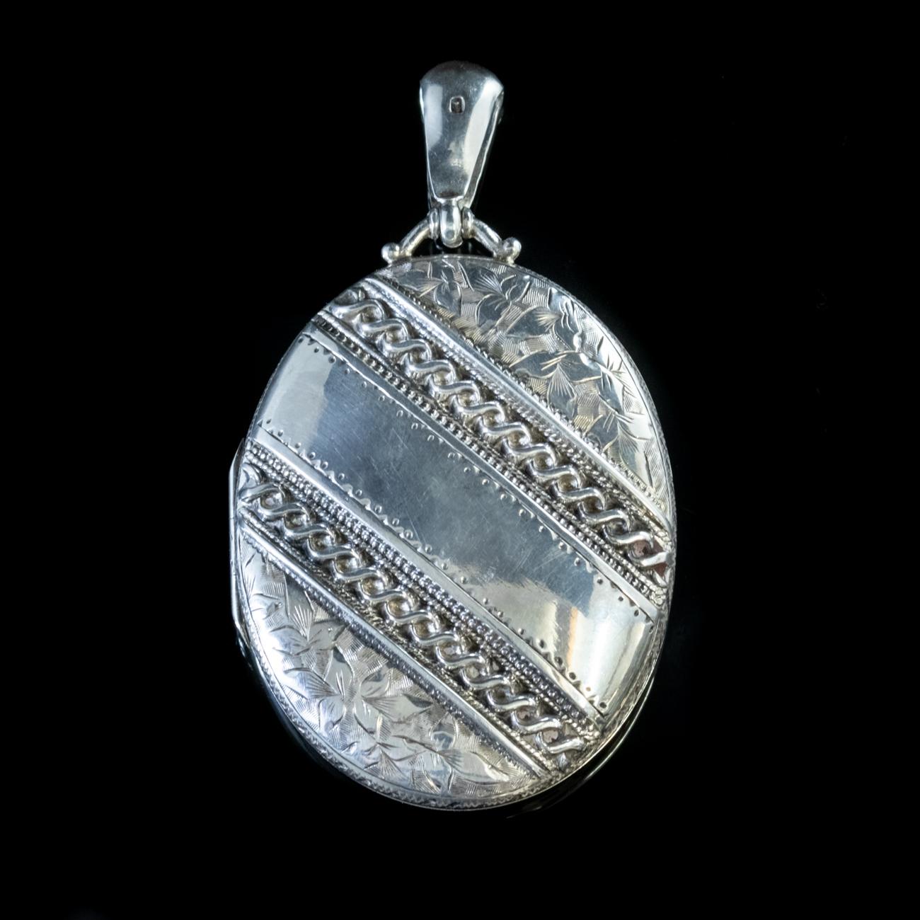 This stunning Antique Victorian Locket dated 1881 has been beautifully crafted in Sterling Silver and engraved with foliate motifs and Ivy.

The Ivy represents an unbreakable bond, such as friendship or marriage, as in the Victorian rhyme ‘Close