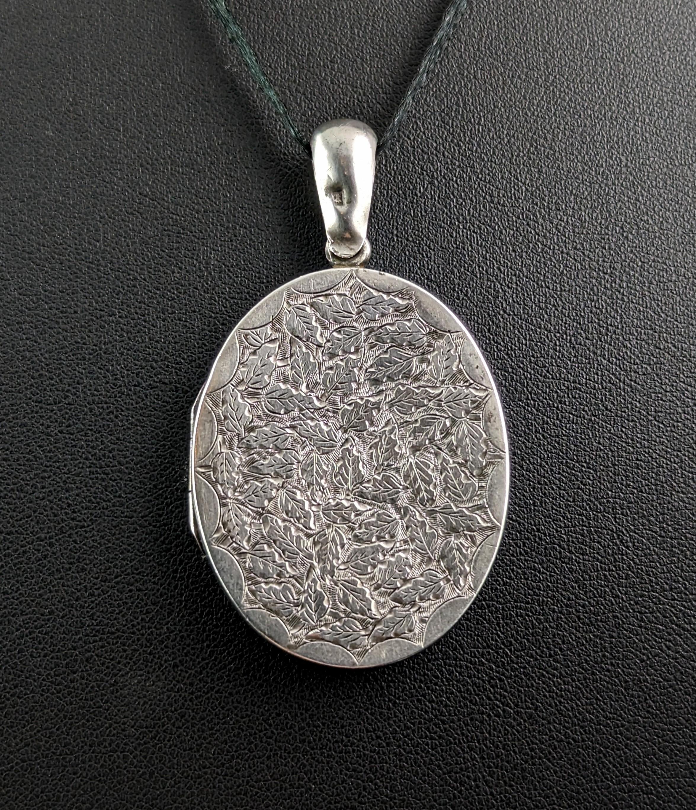 A beautiful Victorian silver locket like this is the perfect piece for adding the finishing touch to your favourite chain or necklace.

This aesthetic era piece is a good sized locket, it has attractive engraving to the front featuring an array of