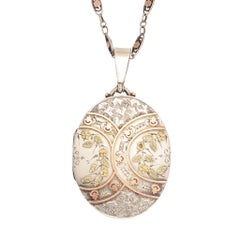 Antique Victorian Silver Oval Locket with Applied Gold Details