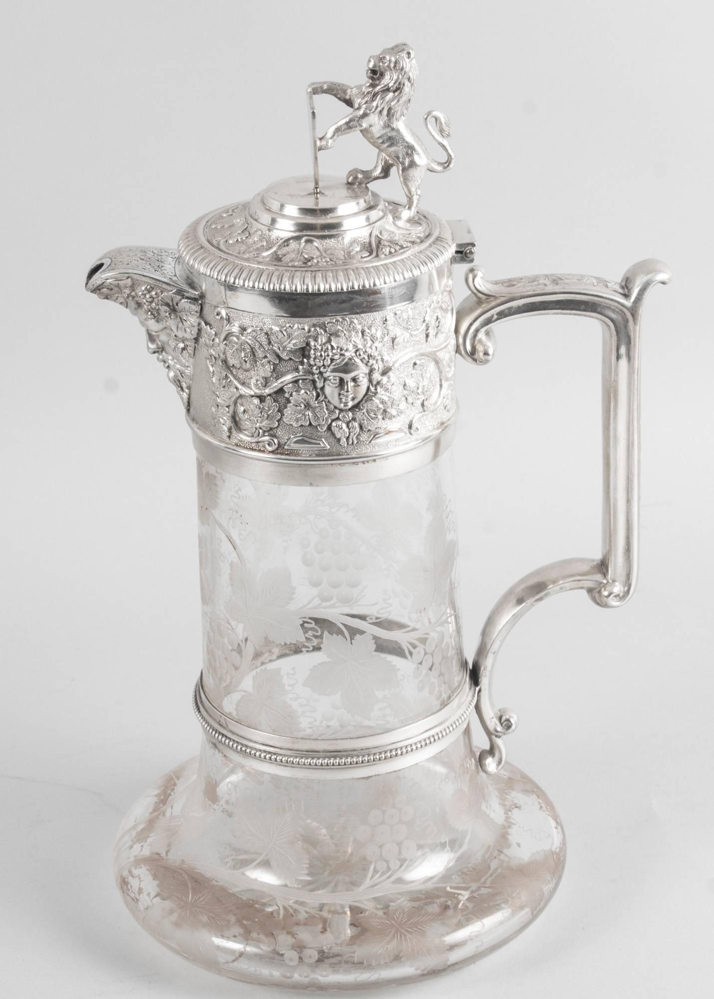 This is a superb English Victorian silver plate and cut crystal claret jug bearing the makers mark of the renowned silversmith Elkington, circa 1870 in date.

The jug features hand etched crystal featuring vines, grapes and leaves, and the silver