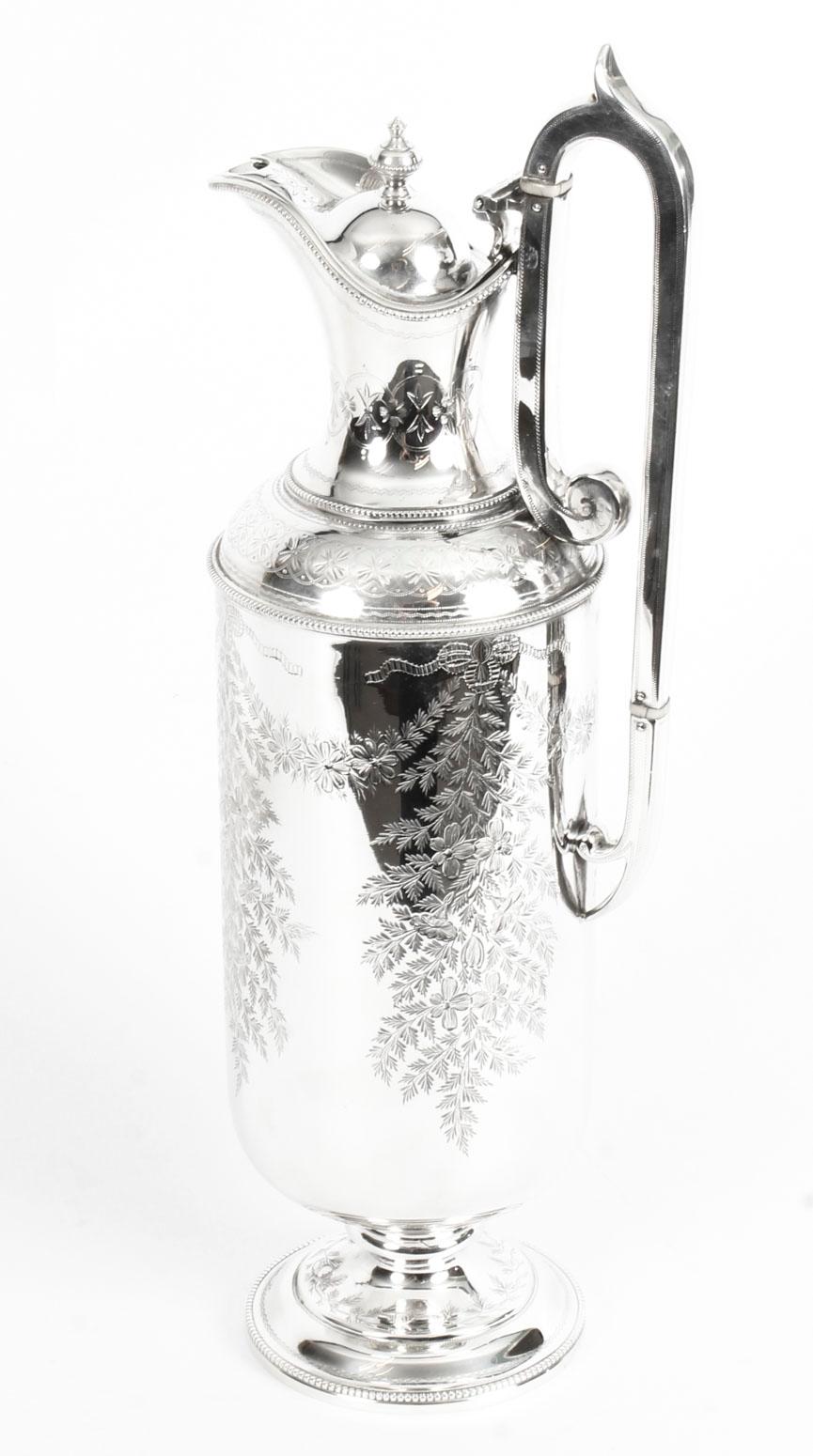 This is an exquisite English Victorian silver plated claret jug, bearing the makers' mark of the renowned silversmiths Martin Hall & Co, Sheffield, circa 1870 in date.
 
This magnificent claret jug has a very stylish circular straight-sided body,