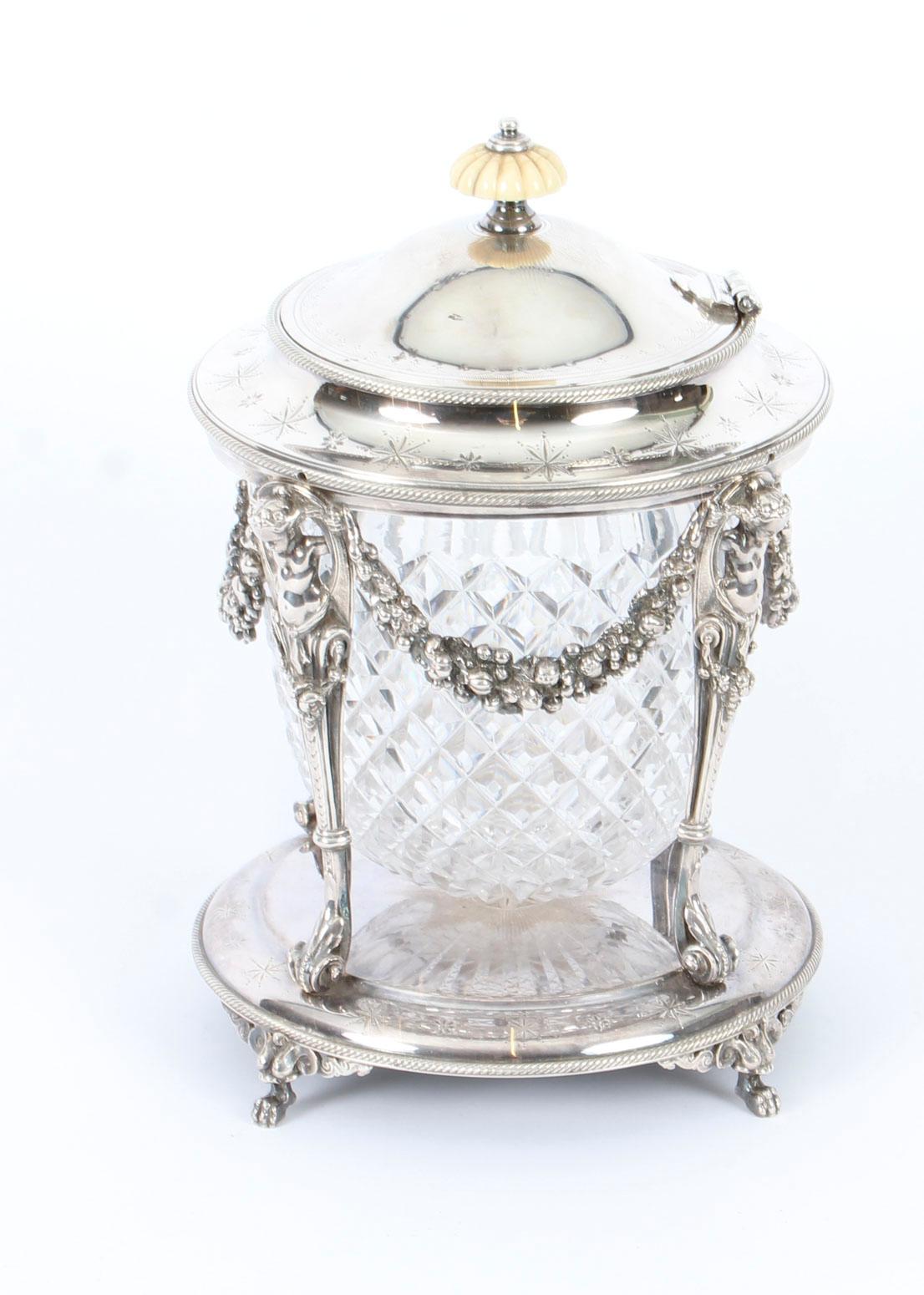This is a superb antique Victorian silver plated and cut glass biscuit barrel, circa 1870 in date.

The biscut barrel bears the maker's mark of the renowned silversmith and retailer, Elkington & Co. 
 
This delightful piece features a diamond