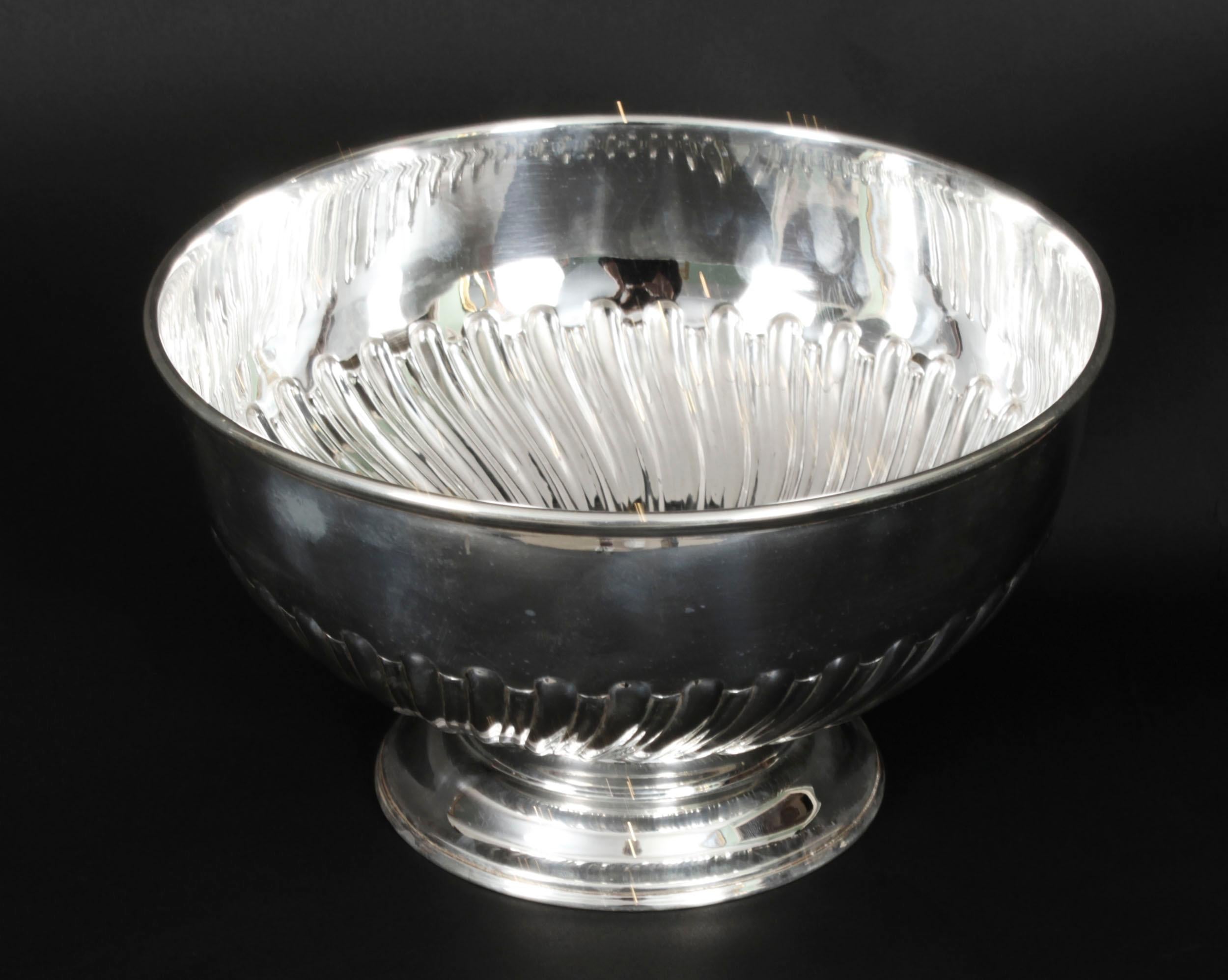 This is a gorgeous antique Victorian silver plate on copper pedestal punch bowl or wine cooler,  Circa 1860 in date and bearing the makers mark C&Co for Carrinfton, 130 Regent Street, London.
 
This exquisite punch bowl has beautiful fluted hammered