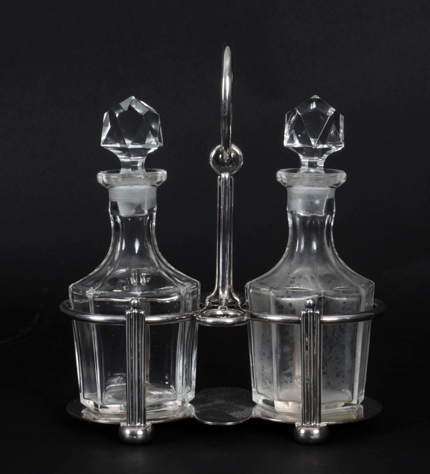 This is a gorgeous antique silver plated cruet set for oil and vinegar, circa 1880 in date.
 
The set comprises a beautifully decorative silver plated cruet stand holding two exquisite cut glass condiment bottles.


The antique silver cruet