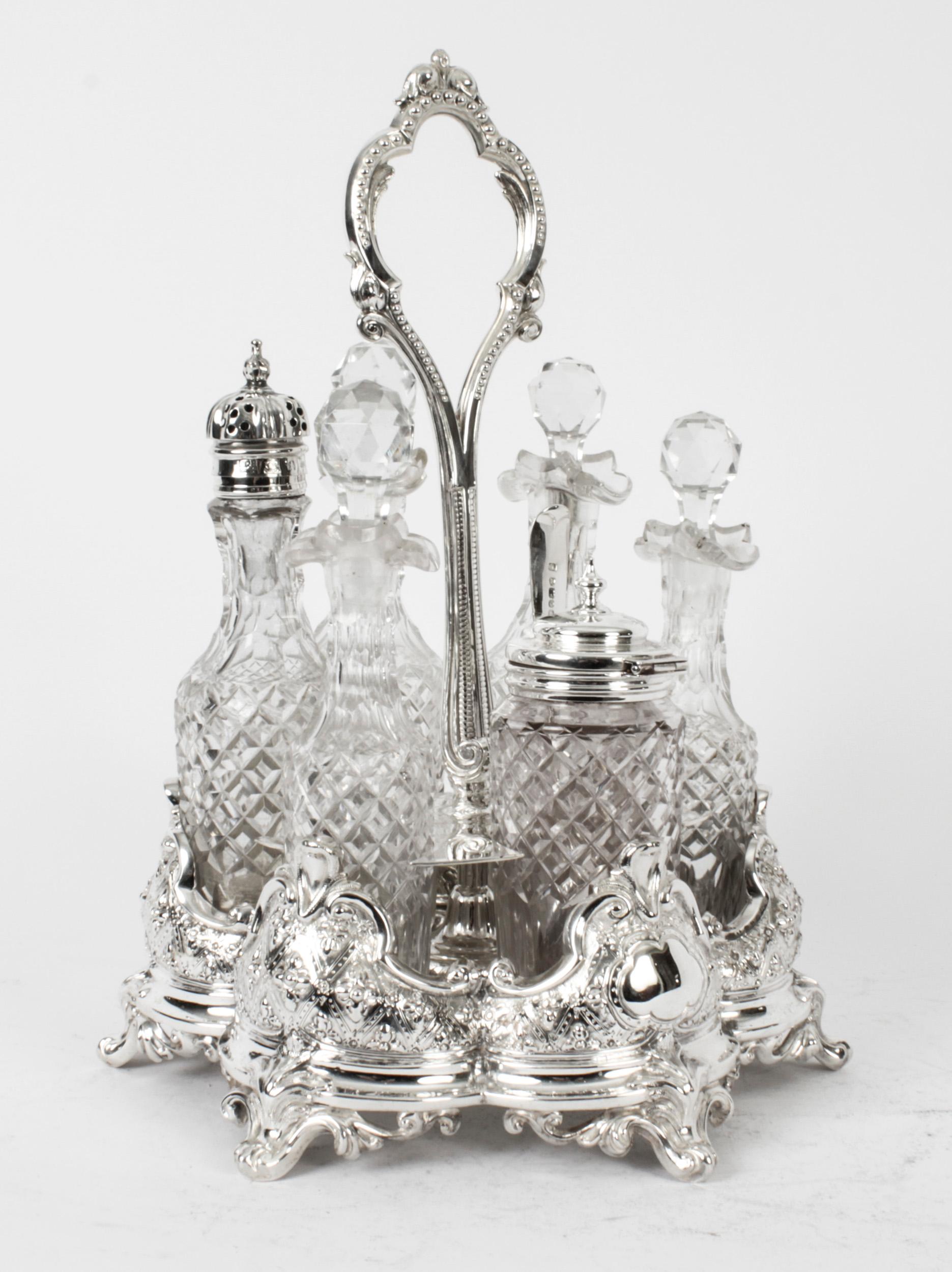 This is a gorgeous antique silver plated cruet set bearing the makers mark of the renowned silversmith family, Henry Wilkinson & Co, and circa 1860 in date.
 
The set comprises a beautifully decorative silver plated cruet stand holding six