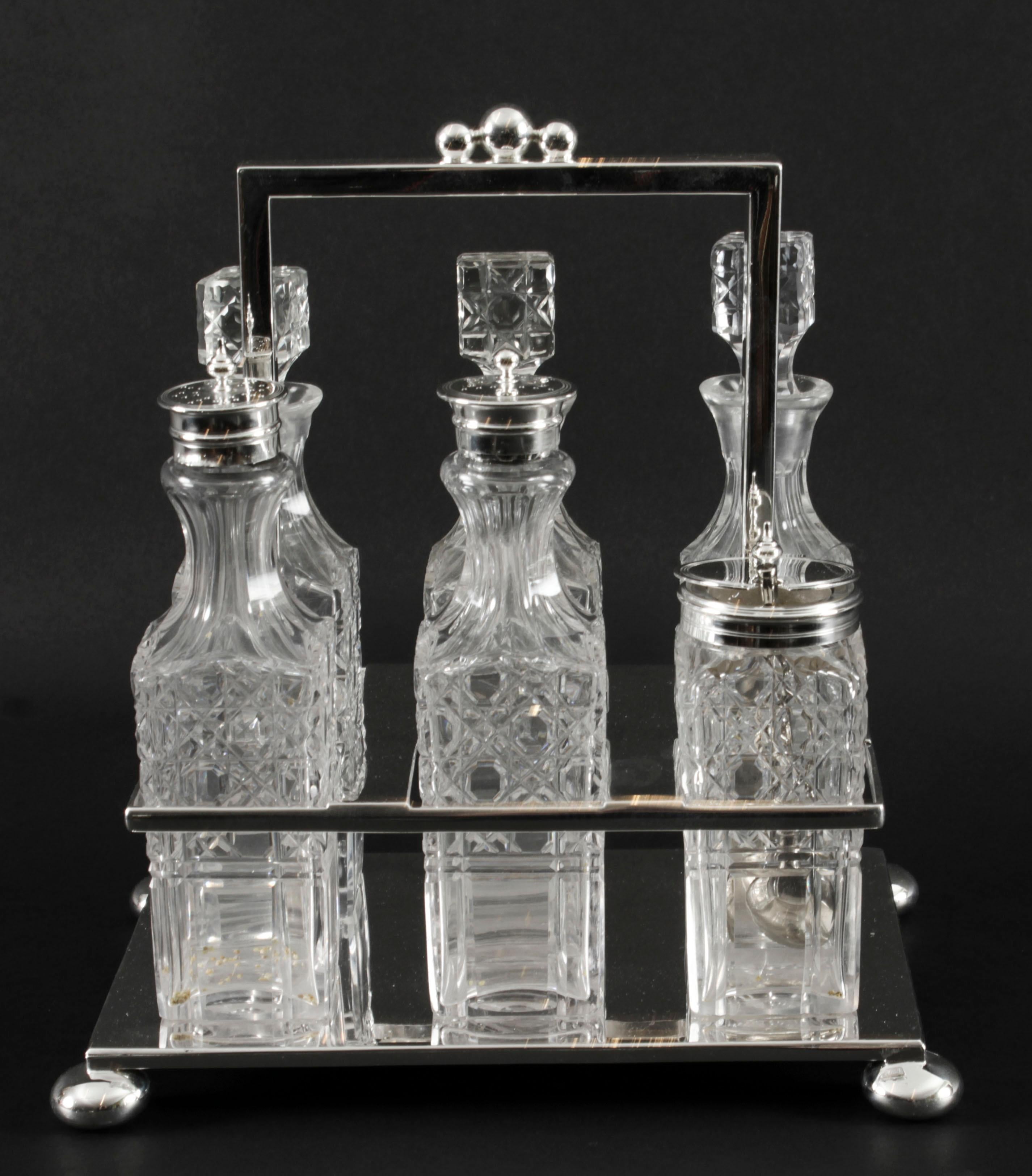 This is a gorgeous antique silver plated cruet set bearing the makers mark of the renowned silversmith Wade, Wingfield Wilkins & Co and circa 1860 in date.
 
The set comprises a beautifully decorative silver plated cruet stand holding six