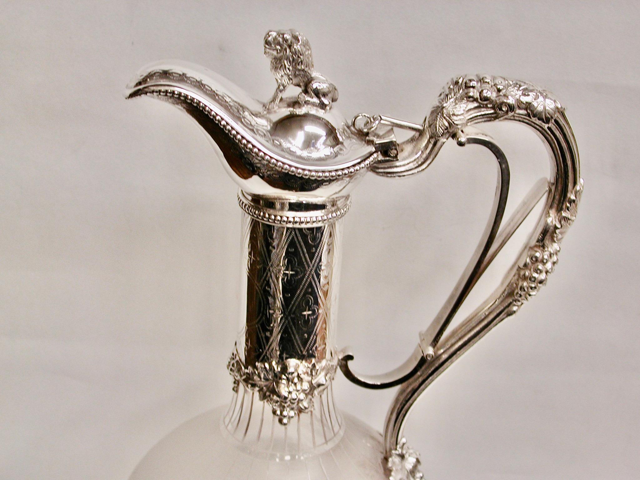 Antique Victorian silver plated and etched glass claret jug, dated circa 1880
Lovely shaped claret jug with a trigger handle, beautifully etched glass decorated with
flowers and leaves and bow festooning.
The silver plated top has grape and vine