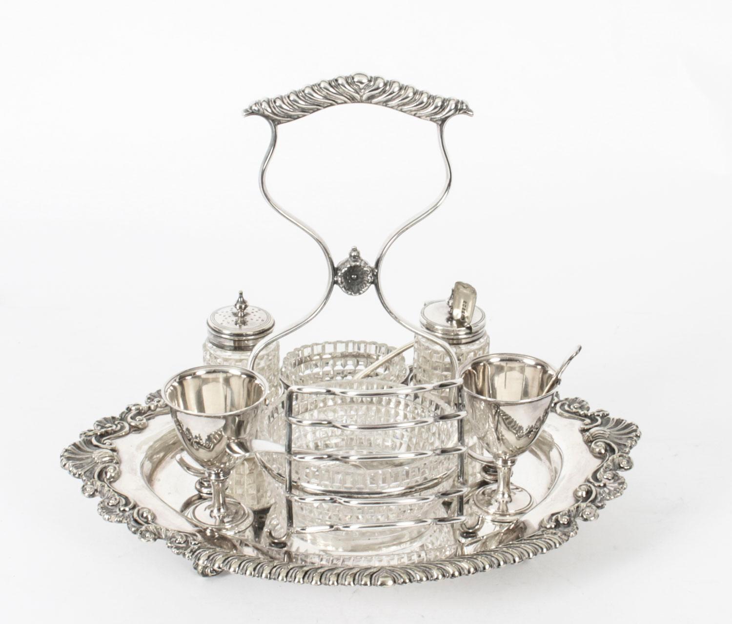 This is an exquisite antique English Victorian silver plated breakfast set bearing the makers mark HH& S for Harrison brothers & Howson and the inventory number 4373, Circa 1860 in date.
 
This splendid set comprises a toast rack, salt and pepper