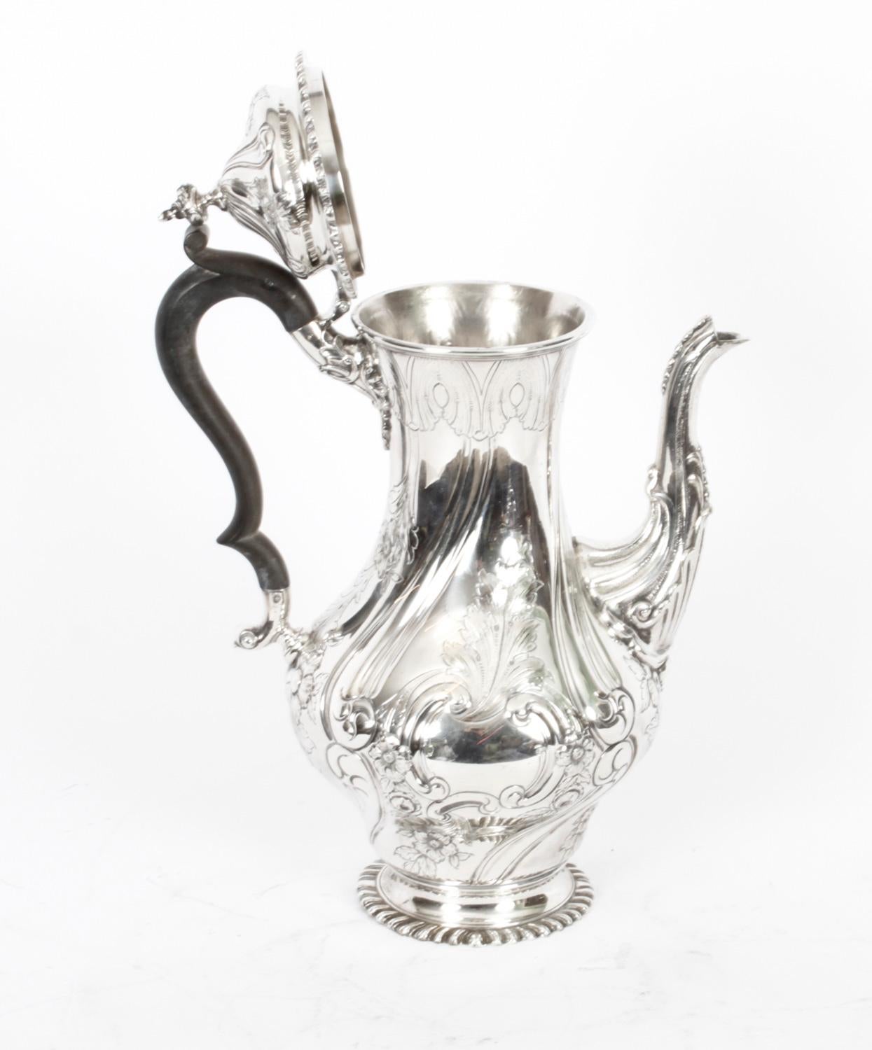 This is a lovely antique Victorian silver plated coffee pot bearing the makers mark of the renowned silversmiths Elkington & Co.
 
It is decorated with an embossed and chased Rococo foliate and floral ornamentation, with an acorn finial to the lid