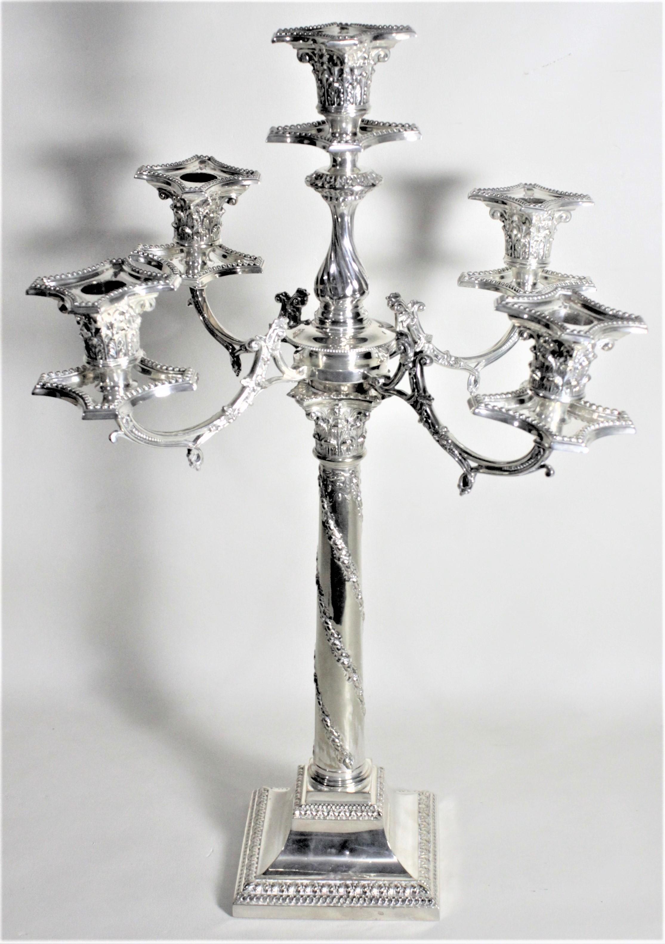 This large and substantial Victorian silver plated candelabra was presumed to have been made in England in circa 1880 in the Victorian style. This candelabra is ornately cast and converts from four branches to two. Or three as desired. The stylized