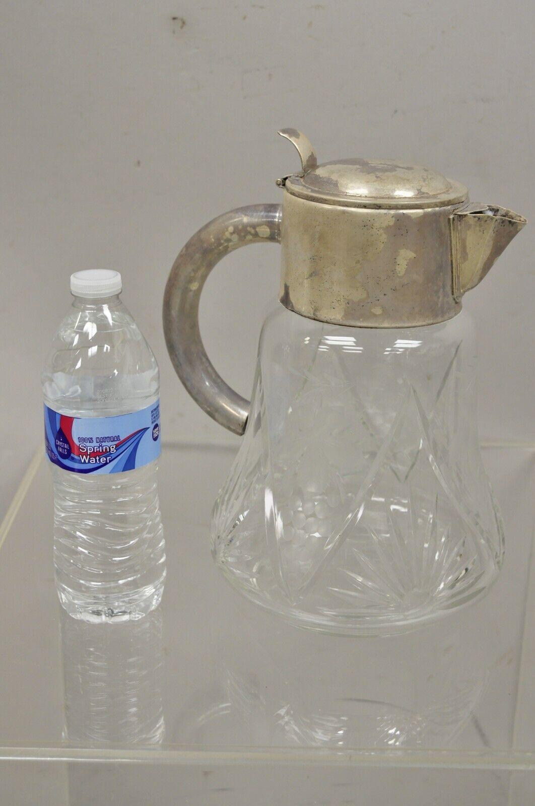 Antique Victorian silver plated cut crystal glass lemonade water pitcher. Circa early 1900s. Measurements: 11