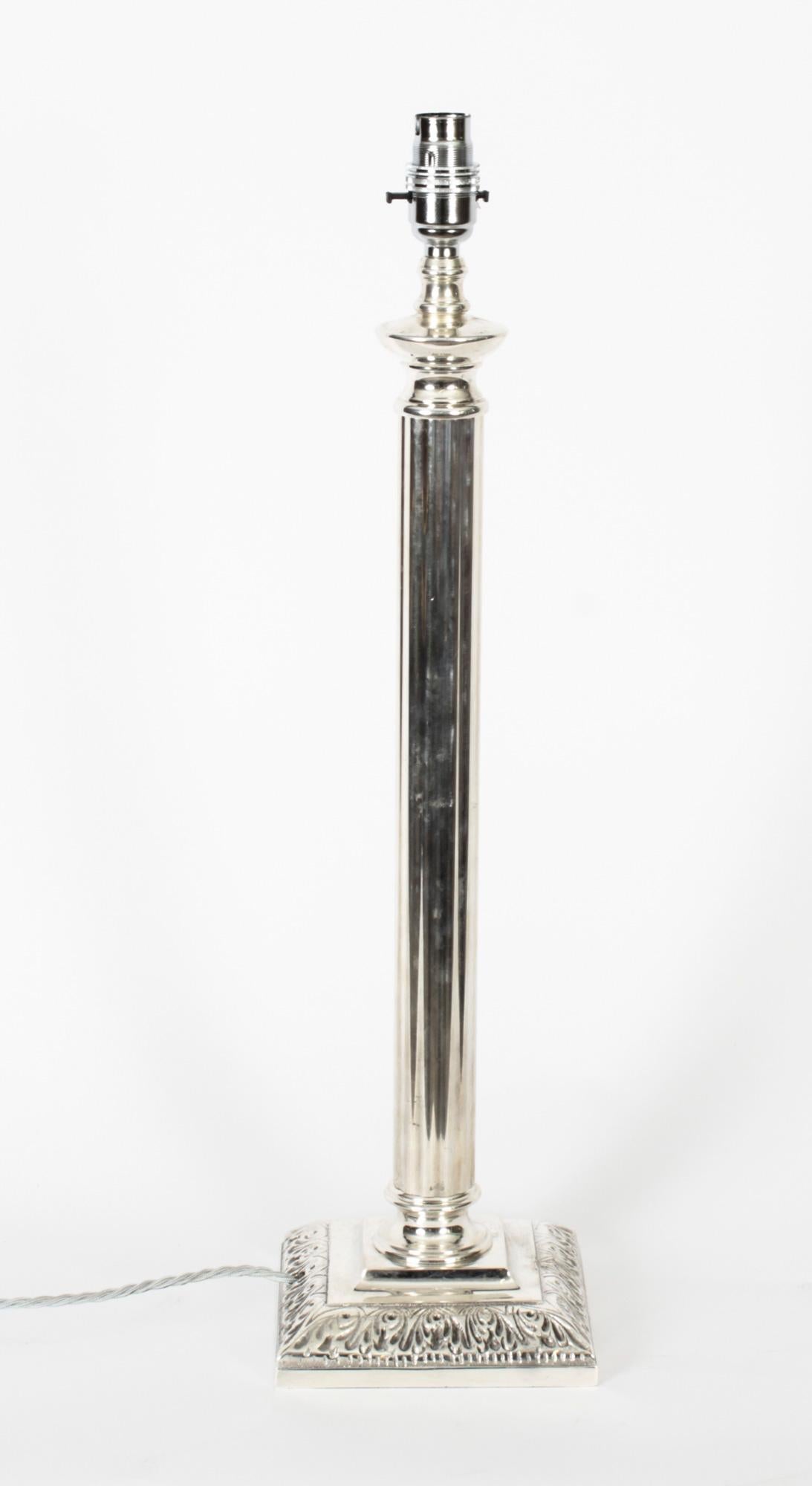 This is an impressive antique Victorian silver plated Doric column table lamp, circa 1890 in date and later converted to electricity.
 
It features a classic Doric Capital decorated with a cylindrical fluted shaft on a square base with deep casr