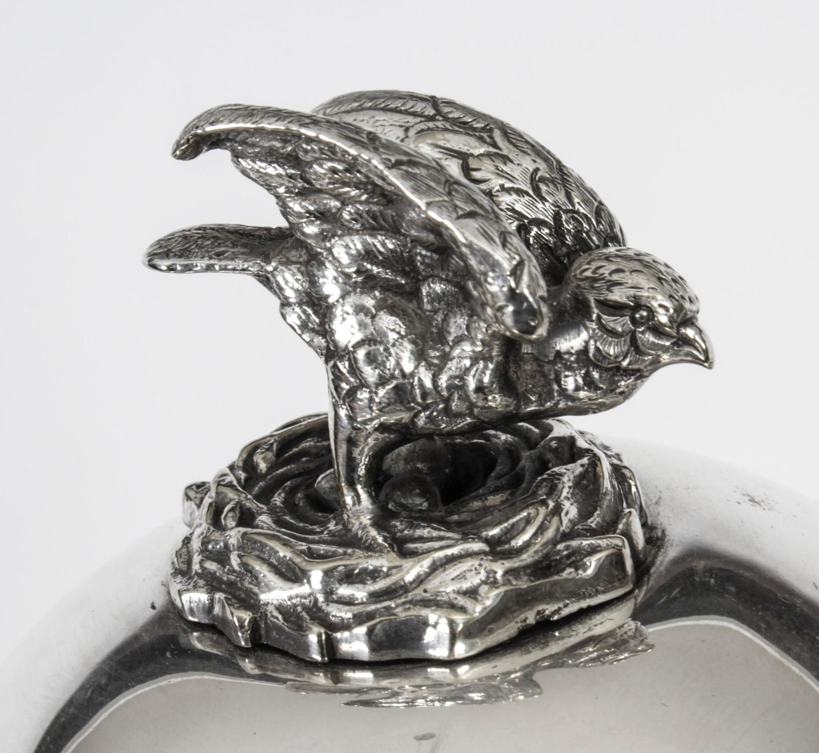 Antique vicrorian silver plated egg coddler / boiler circa 1860 in date.
 
The cylindrical shaped body features an winged Kestrel bird finial to the domed lid which contains a frame to hold the eggs while they are cooked. It is raised on a