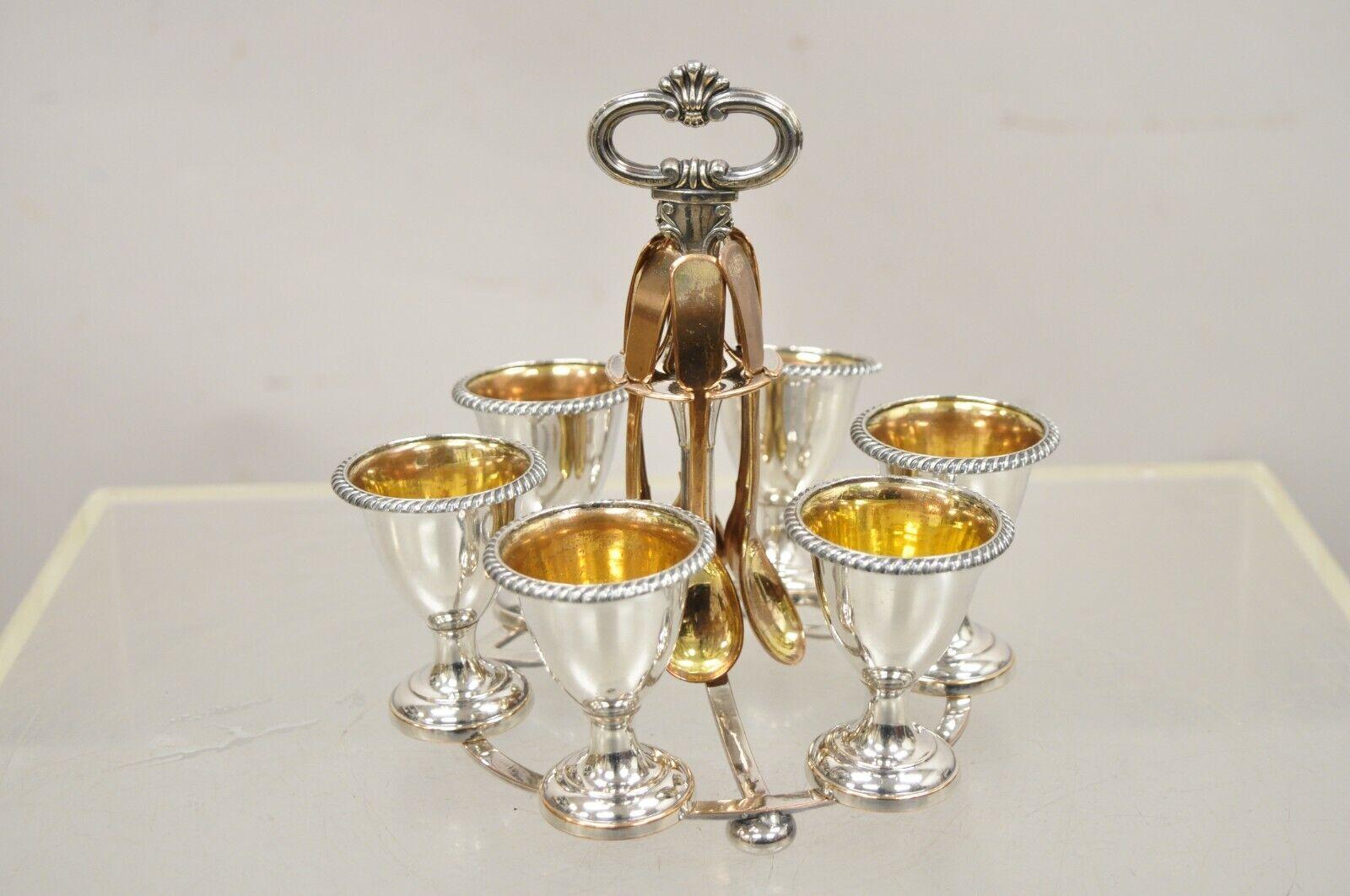 Antique Victorian Silver Plated Egg Server with Spoon Set - Serving for 6. Item featured is an elegant antique silver plate and gold wash egg server for 6. Circa Early 1900s. Measurements: 7