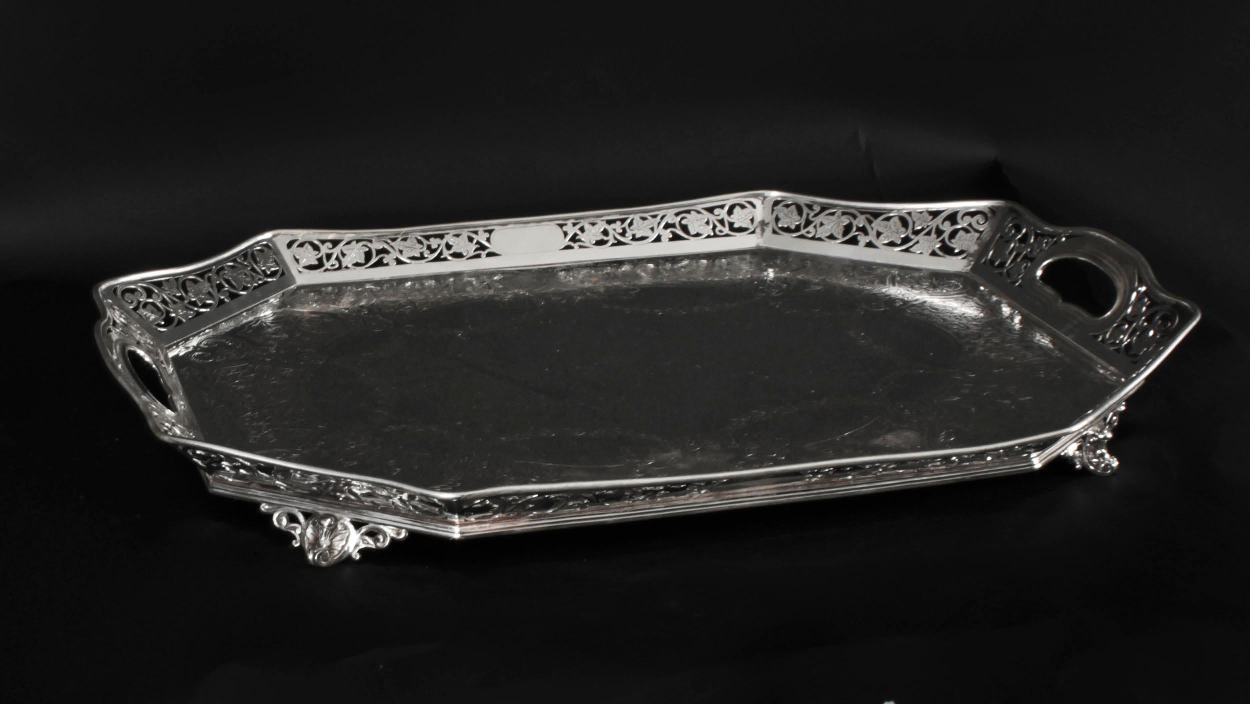 This is a lovely superb quality antique Victorian silver plated on copper gallery tray  bearing the makers mark of the renowned silversmith L&W for Lee & Wigfull, Sheffield, England, Circa 1880.
 
This shaped rectangular tray has cut off corners