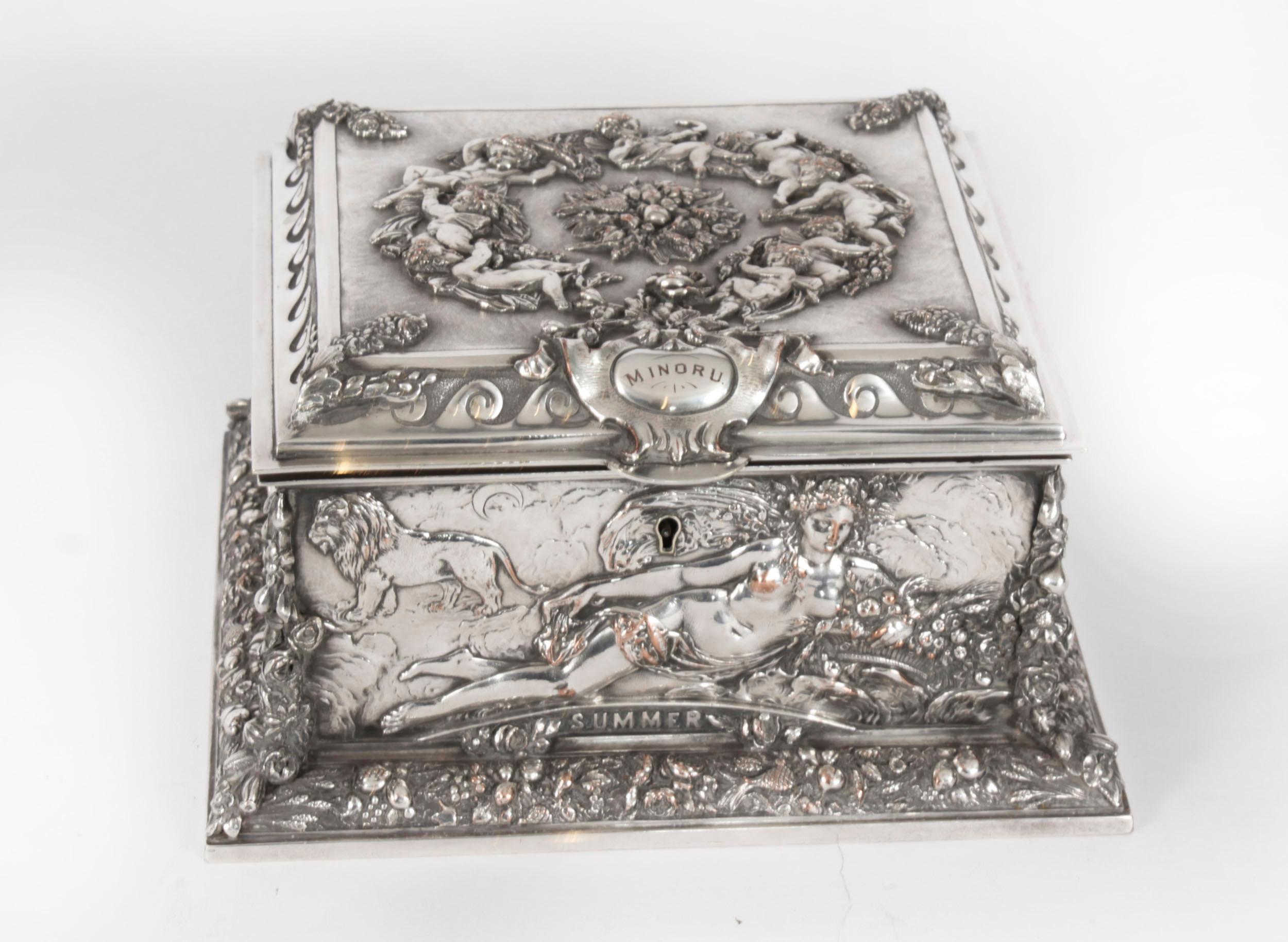 This is a lovely antique Victorian silver plated casket bearing the makers mark of the renowned silversmiths, Walker and Hall, Circa 1840 in date.

The square casket freatures an epic mythological scene of the four seasons with eight winged cherubs
