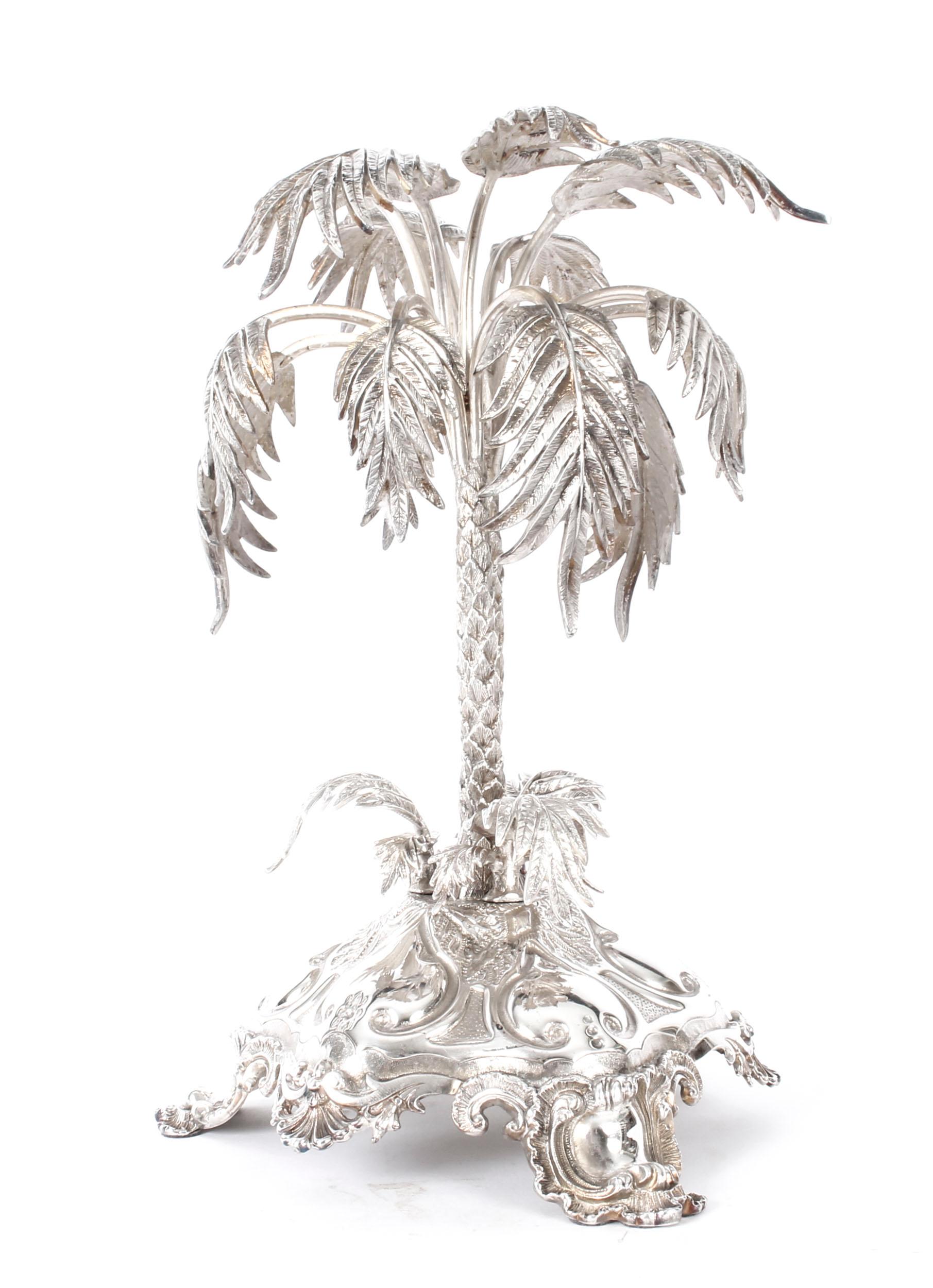 This is an exquisite antique silver plated Victorian Naturalism Movement palm tree centrepiece, circa 1870 in date, and bearing the makers mark of the renowned retailer and silversmith Mappin & Webb, London & Sheffield.

There is no mistaking the
