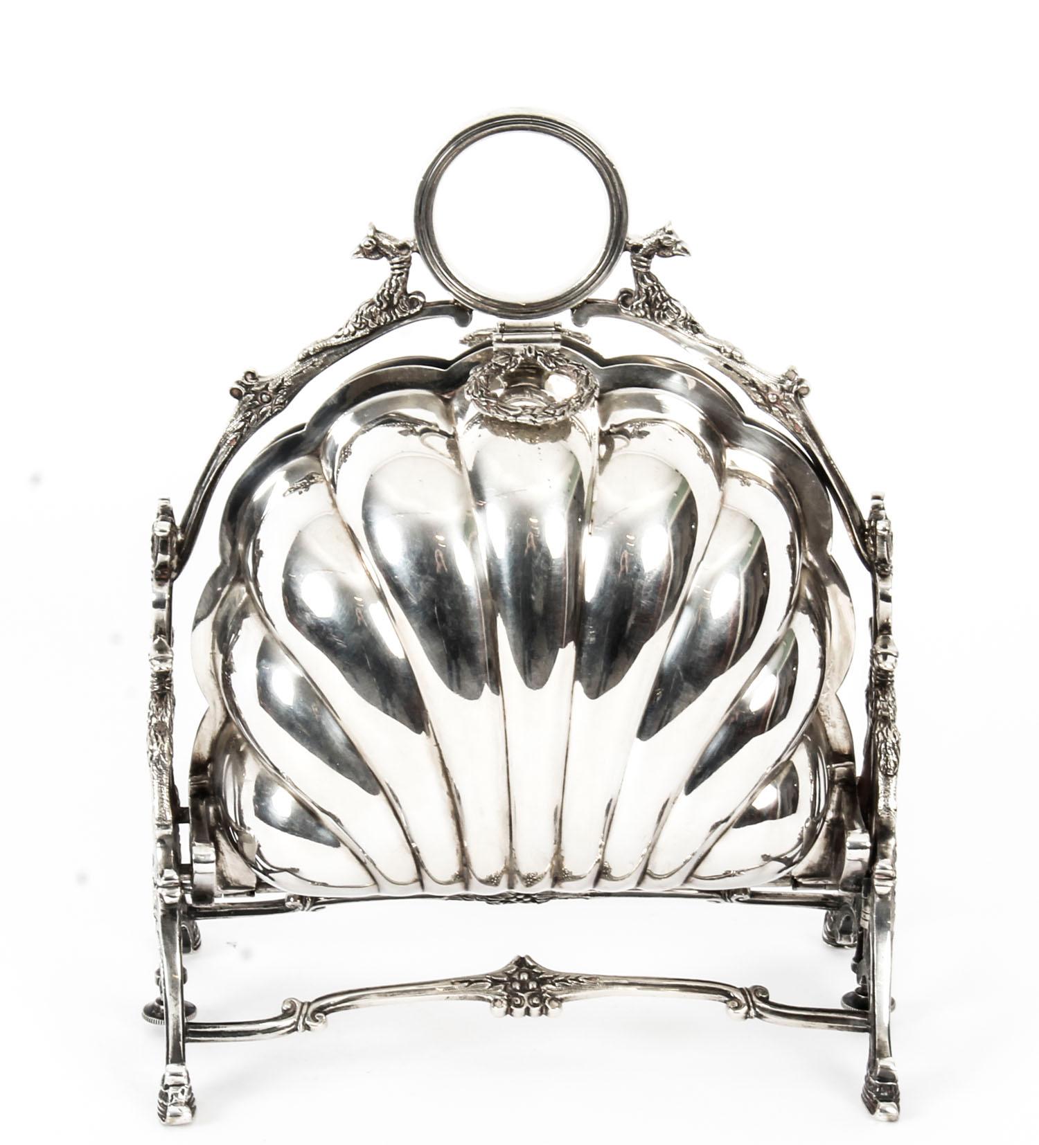This is a highly decorative antique Victorian silver plated folding biscuit box, the base bearing the makers' mark of the renowned silversmiths Walker & Hall of Sheffield, England, circa 1888 in date and bearing the year stamp 88.

It has a plain