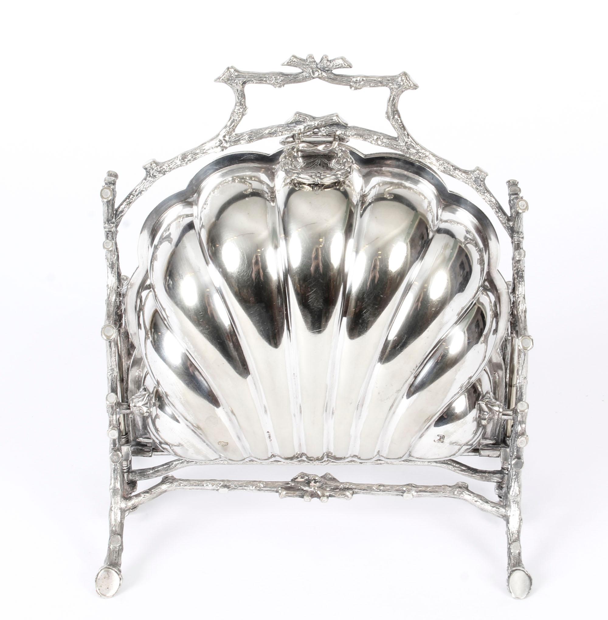 This is a highly decorative antique Victorian silver plated folding biscuit box, the base bearing the makers' mark of the renowned silversmiths Fenton Brothers of Sheffield, England, circa 1890 in date and bearing the registration number 3549 as