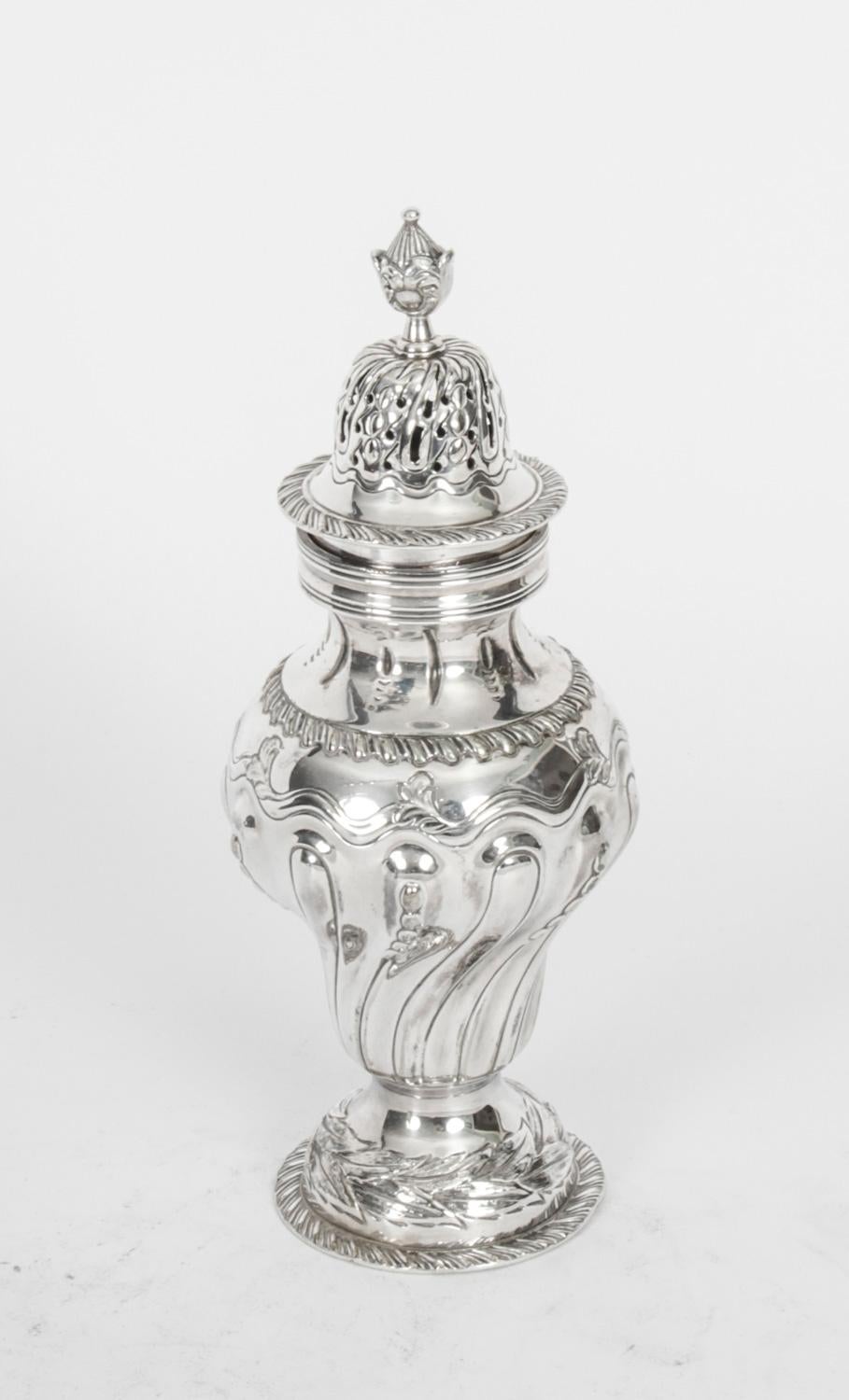 A large beautiful Victorian silver plated sugar caster made by William Batt & Sons Ltd, circa 1860 in date.
 
It features typical baluster form and is embossed with lavish decoration of lattice work and scrolls, the pierced pull-off lid with