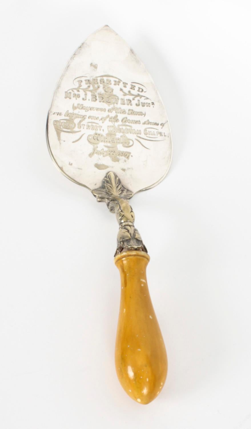 This is a fabulous Victorian silver plated Trowel, dated 1867 in date.

The spade shaped trowel has been superbly engraved with a dedication to a Church corner stone laying ceremony. The handle is very ornate with a vacant beaded