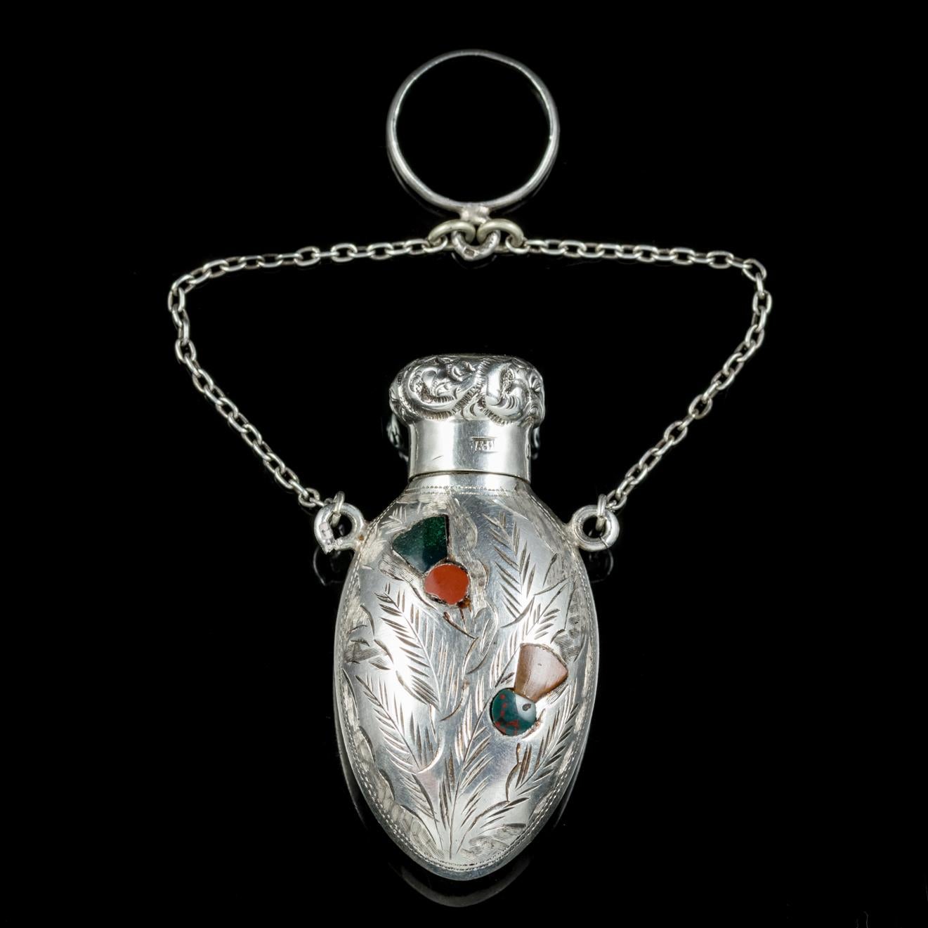 This fabulous antique Victorian Scottish perfume bottle pendant is hallmarked Birmingham 1878. 

Perfume bottle jewellery gained in popularity during the Victorian era and were used to hide a small vile of perfume inside for the wearer to use when